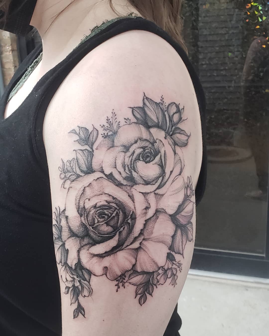Roses dotwork tattoo on the shoulder by Sarah Spread