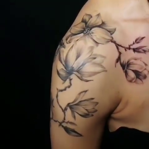 Magnolia branch realism tattoo by Lindsay