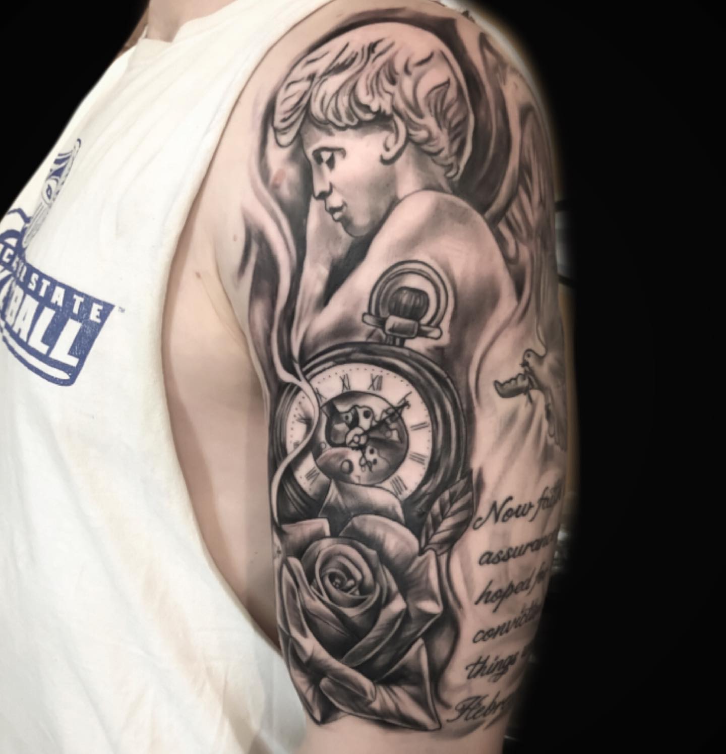 Cherub with pocket watch realism tattoo on the upper arm by Breyner, Cambridge, Massachusetts
