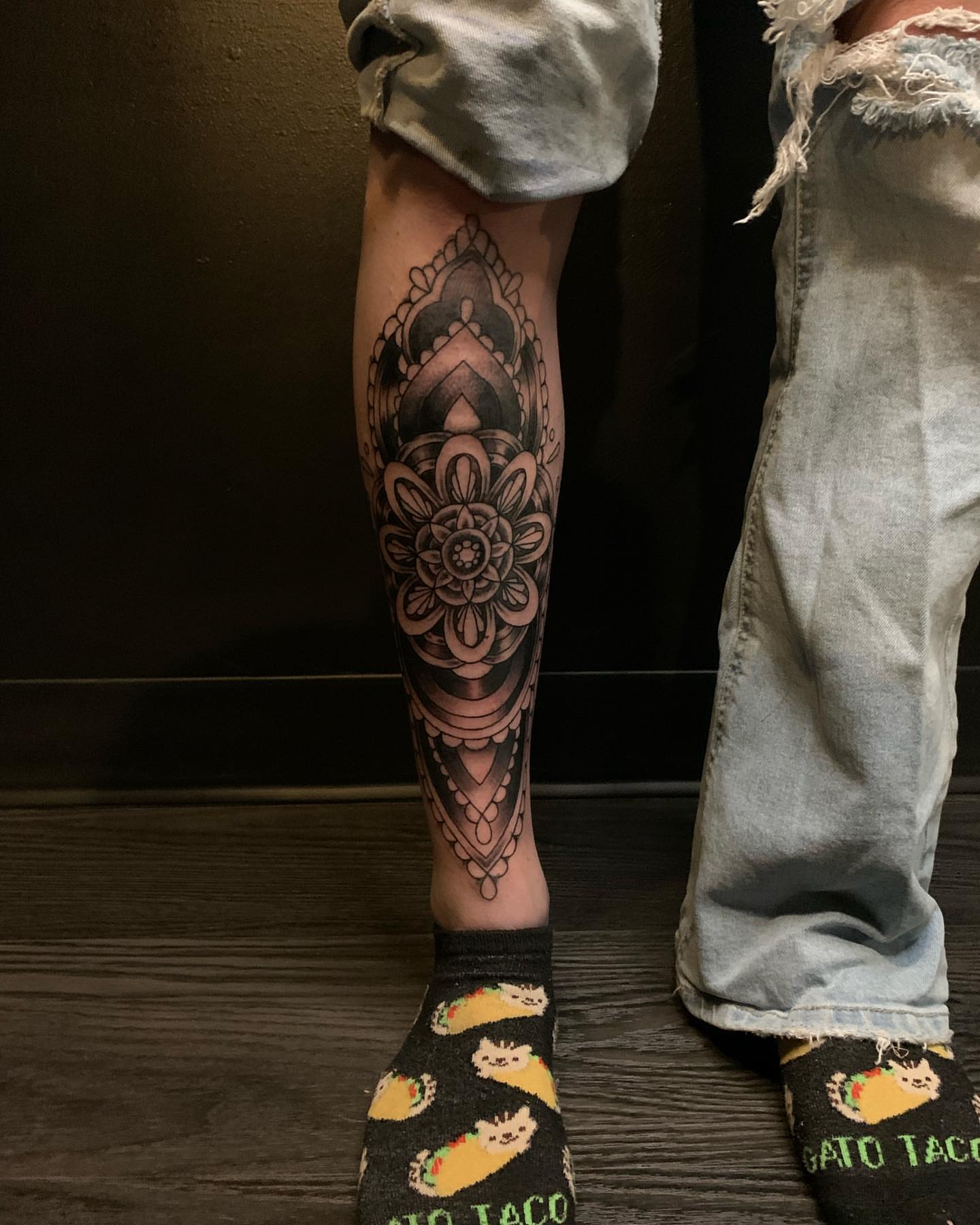 Mandala black and grey tattoo on the calf by Seth Scott