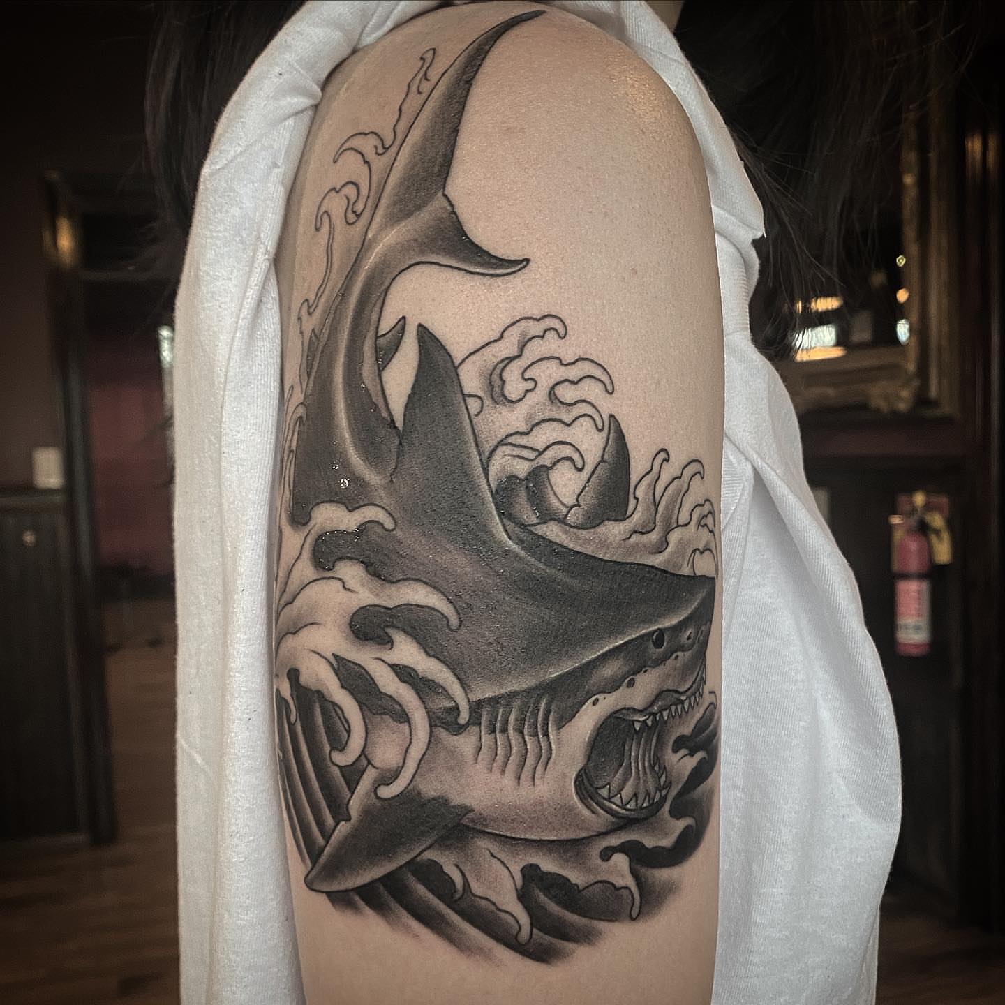 Shark realism tattoo on the upper arm by ⠀⠀ ⠀ ⠀ ⠀⠀ ⠀⠀ ⠀⠀ ⠀ ⠀⠀ ⠀⠀ᎪᎳᏃ, West Hollywood, California