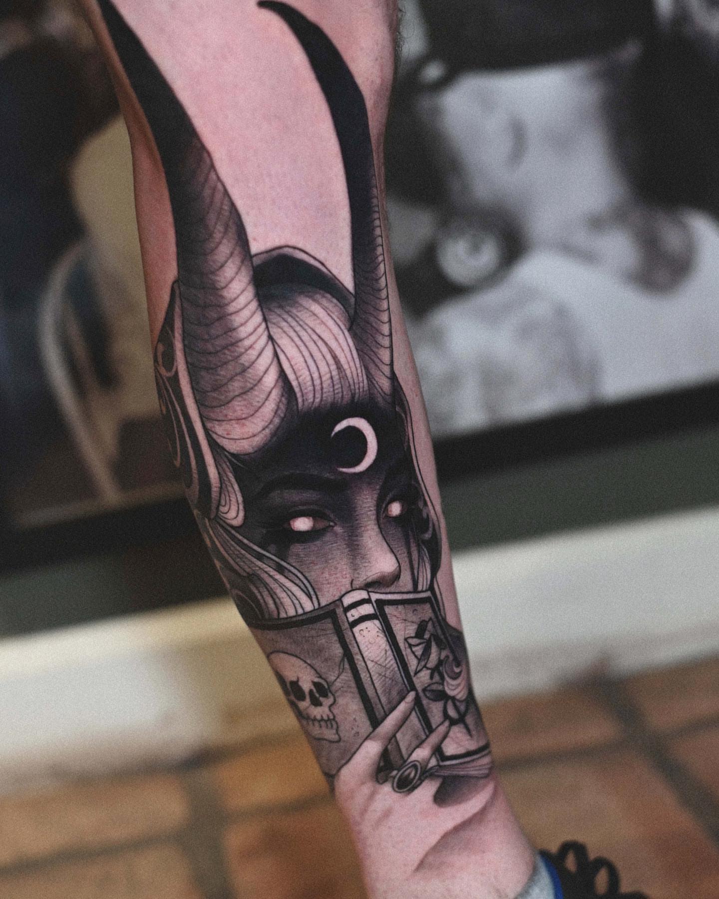 Female demon dark realism tattoo on the forearm by Lorenzo Lopez