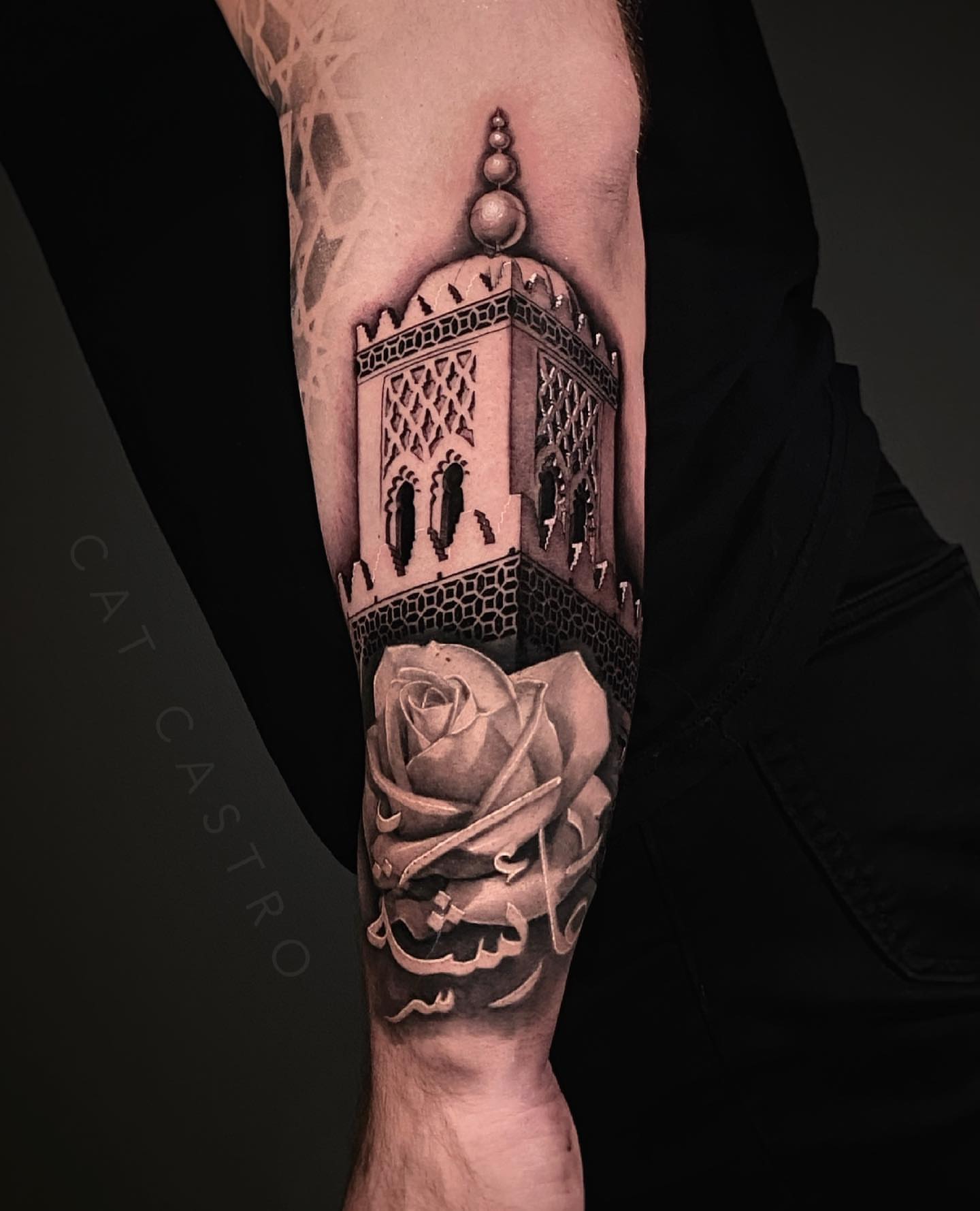 Arabic tower and rose realism tattoo on the forearm by Cat Castro