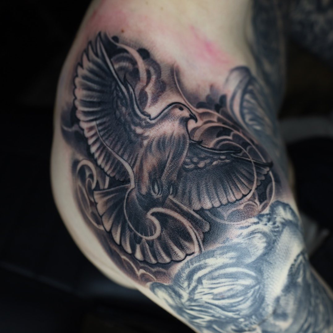 Eagle black and grey tattoo on the forearm by Tattoos By Chino