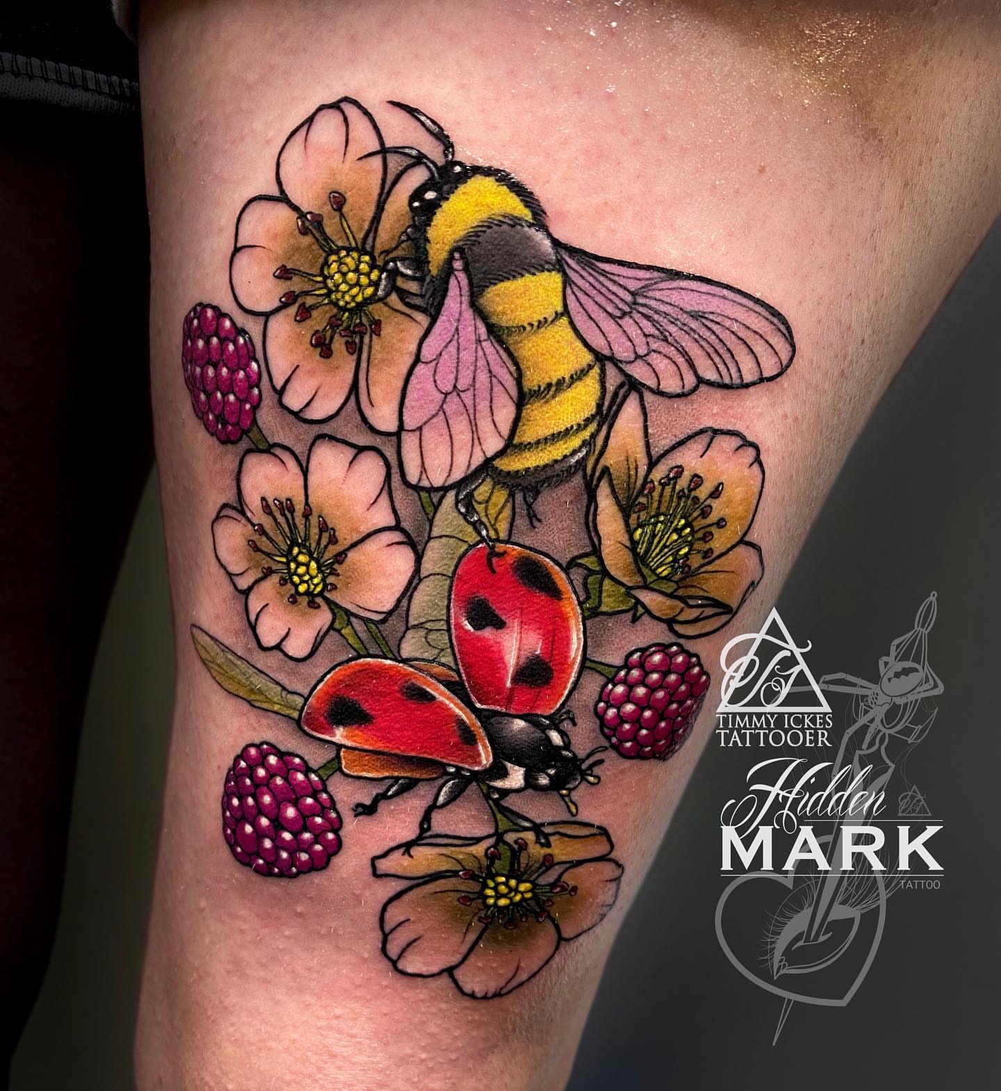 Bee and flowers realism tattoo on the thigh by Timmy Ickes