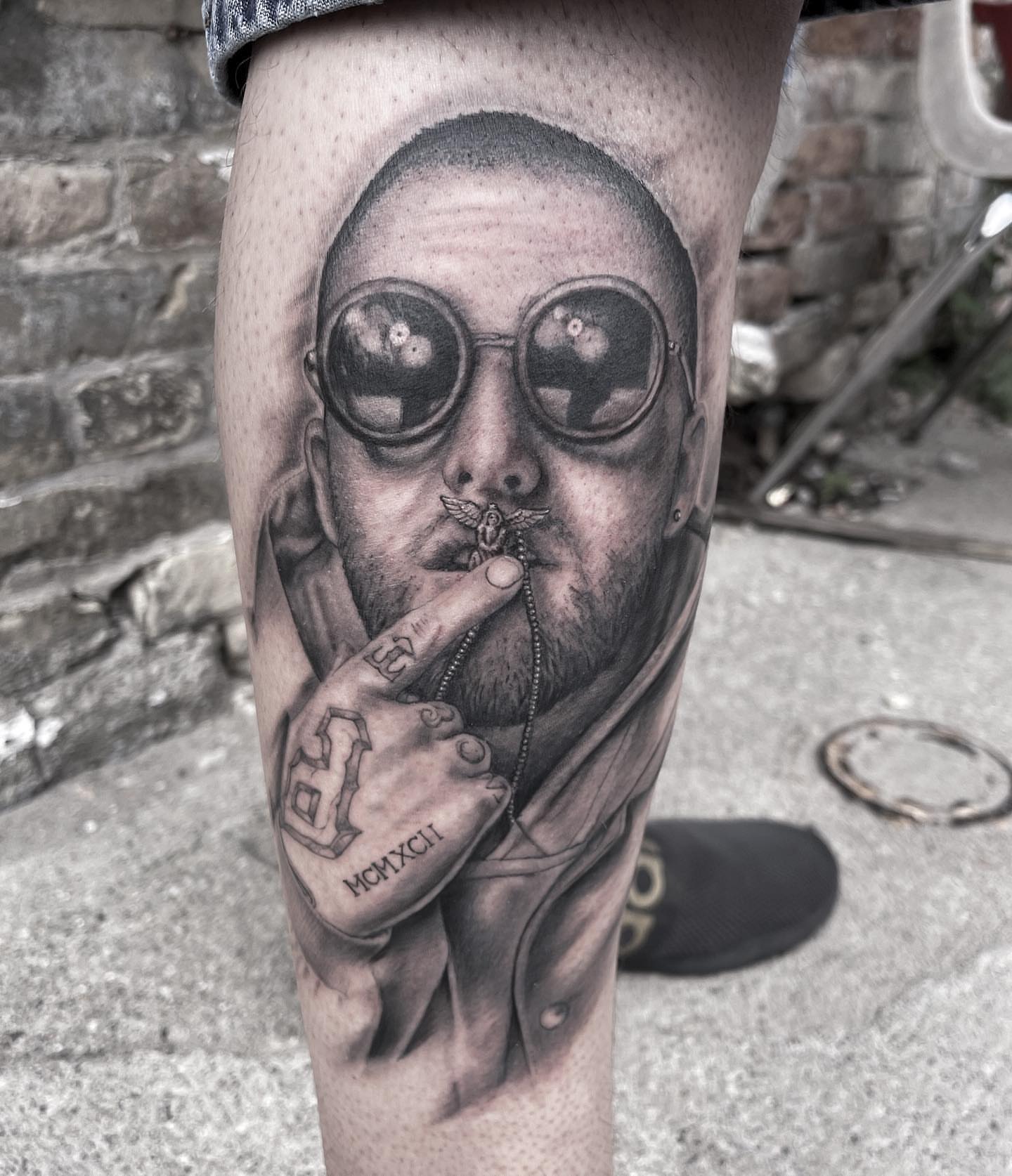 Smoking man realism tattoo on the forearm by Michigan Tattoo Artist