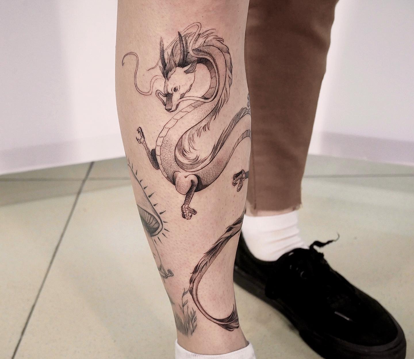 Dragon dotwork tattoo on the calf by Tattoo San Diego