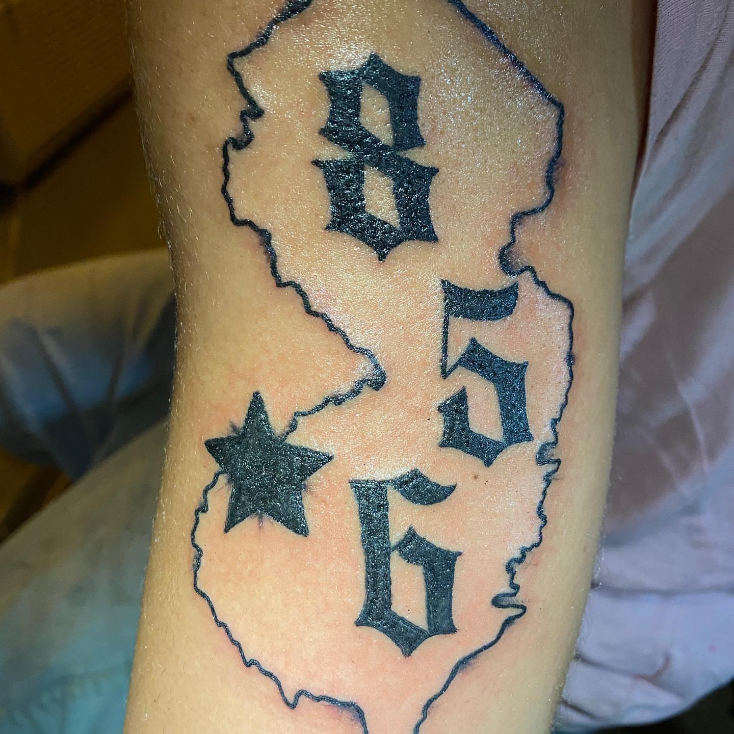 California state outline American traditional tattoo on the forearm by Nick