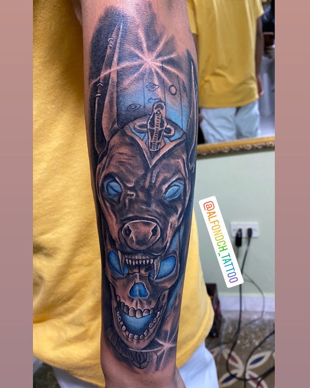 Cyborg dog realism tattoo on the forearm by Alfonso Duenas