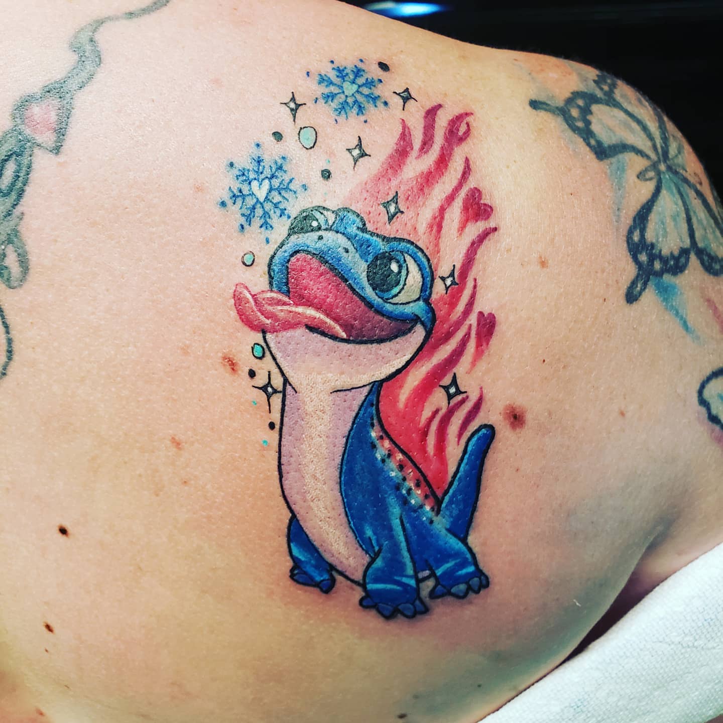 Stitchy stitch new school tattoo on the shoulder by Glen Wallis