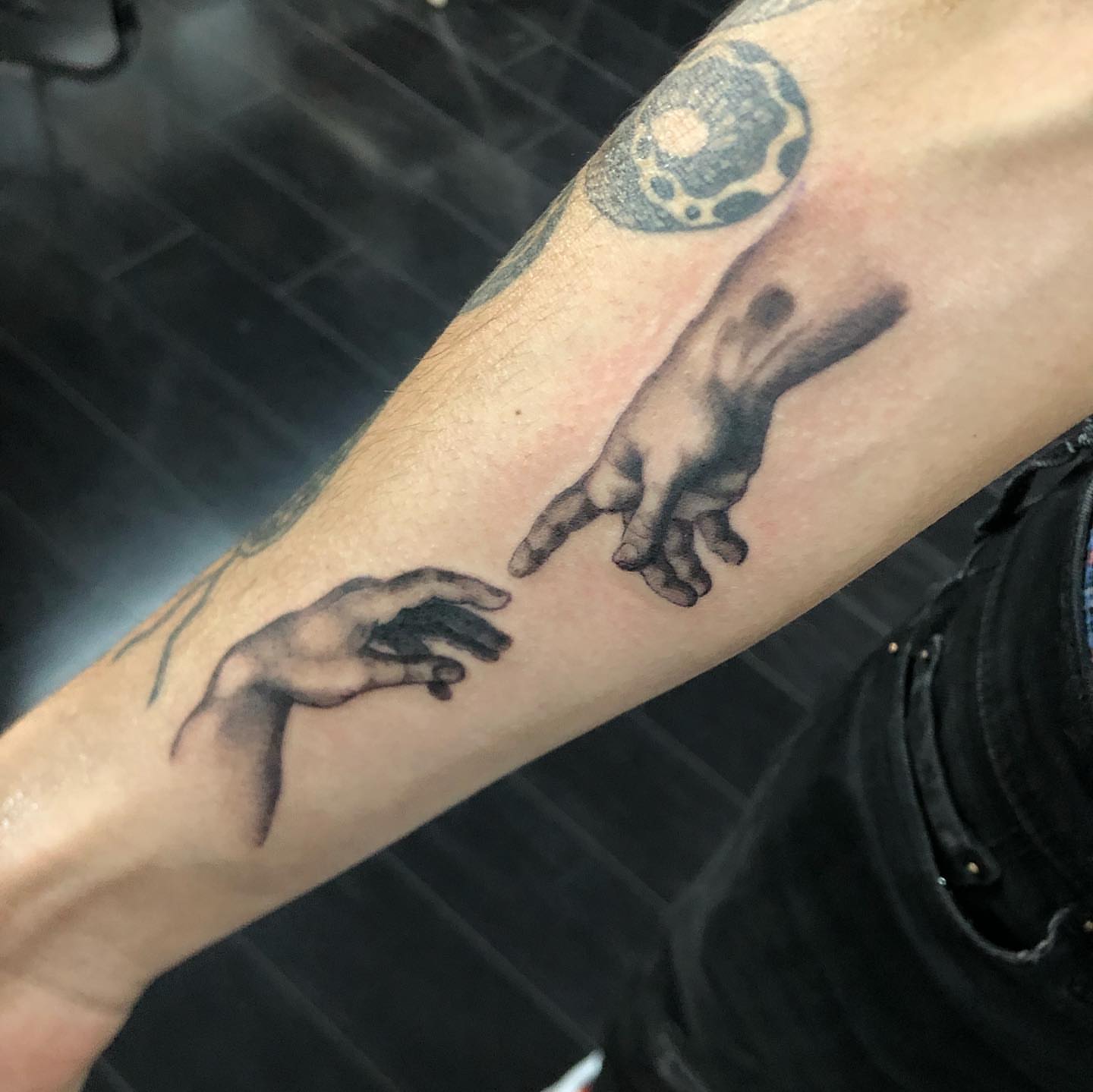 Creation scene realism tattoo on the forearm by Tattoos by Rey G.