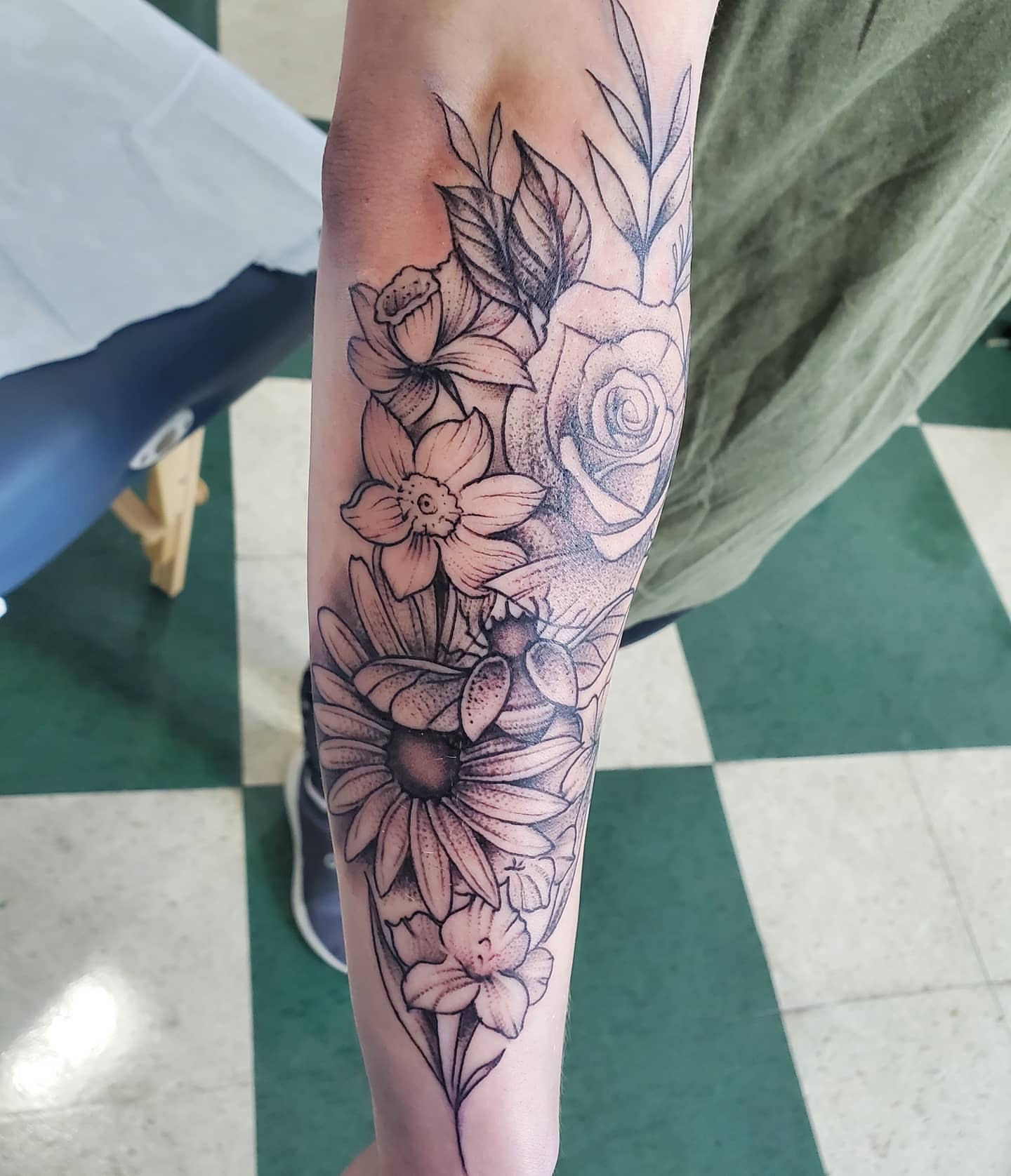 Floral bouquet dotwork tattoo on the forearm by David Nash, Evansville, Indiana