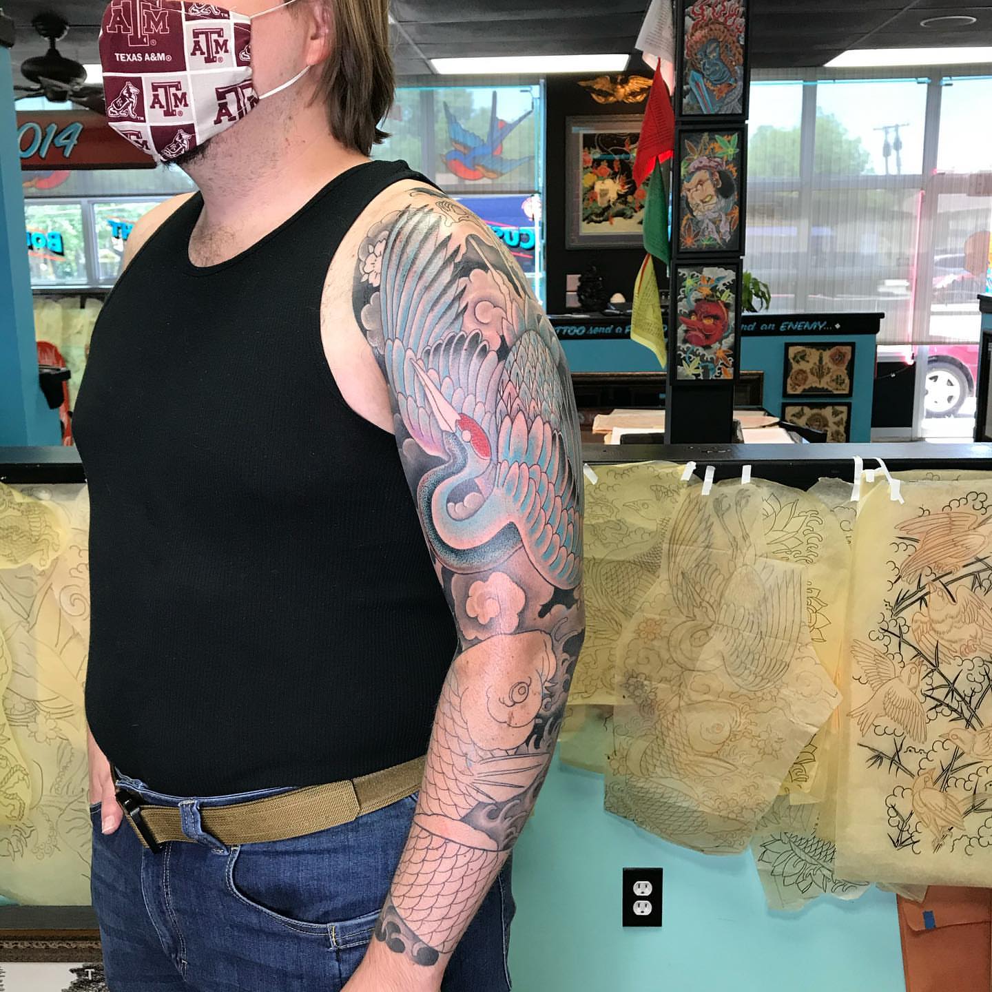 Bird and clouds japanese irezumi tattoo on the upper arm by Mark Thompson, Dallas, Texas