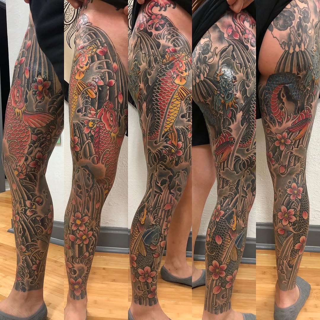 Koi fish and cherry blossoms Japanese tattoo on the leg by Tony Beuke