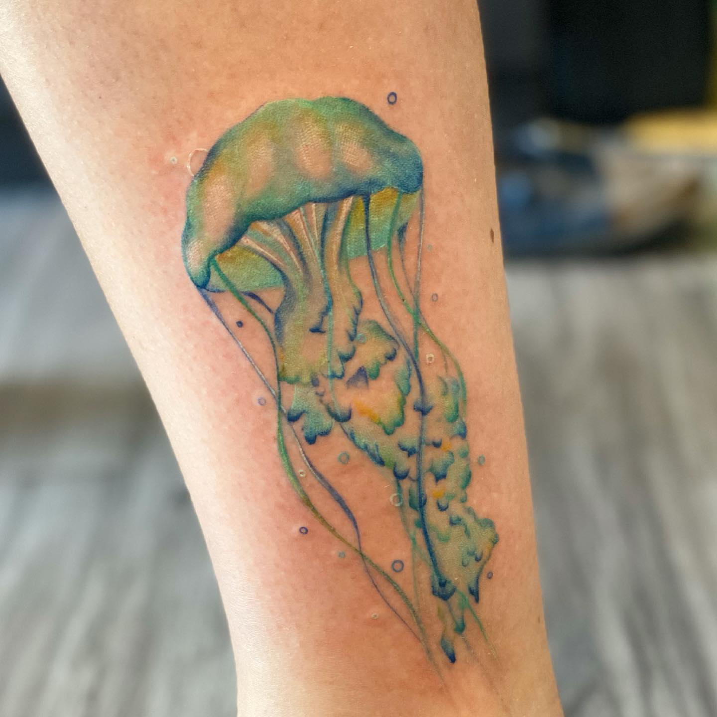 Jellyfish watercolor tattoo on the forearm by Tattoos by Hanna, Farmington Hills, Michigan