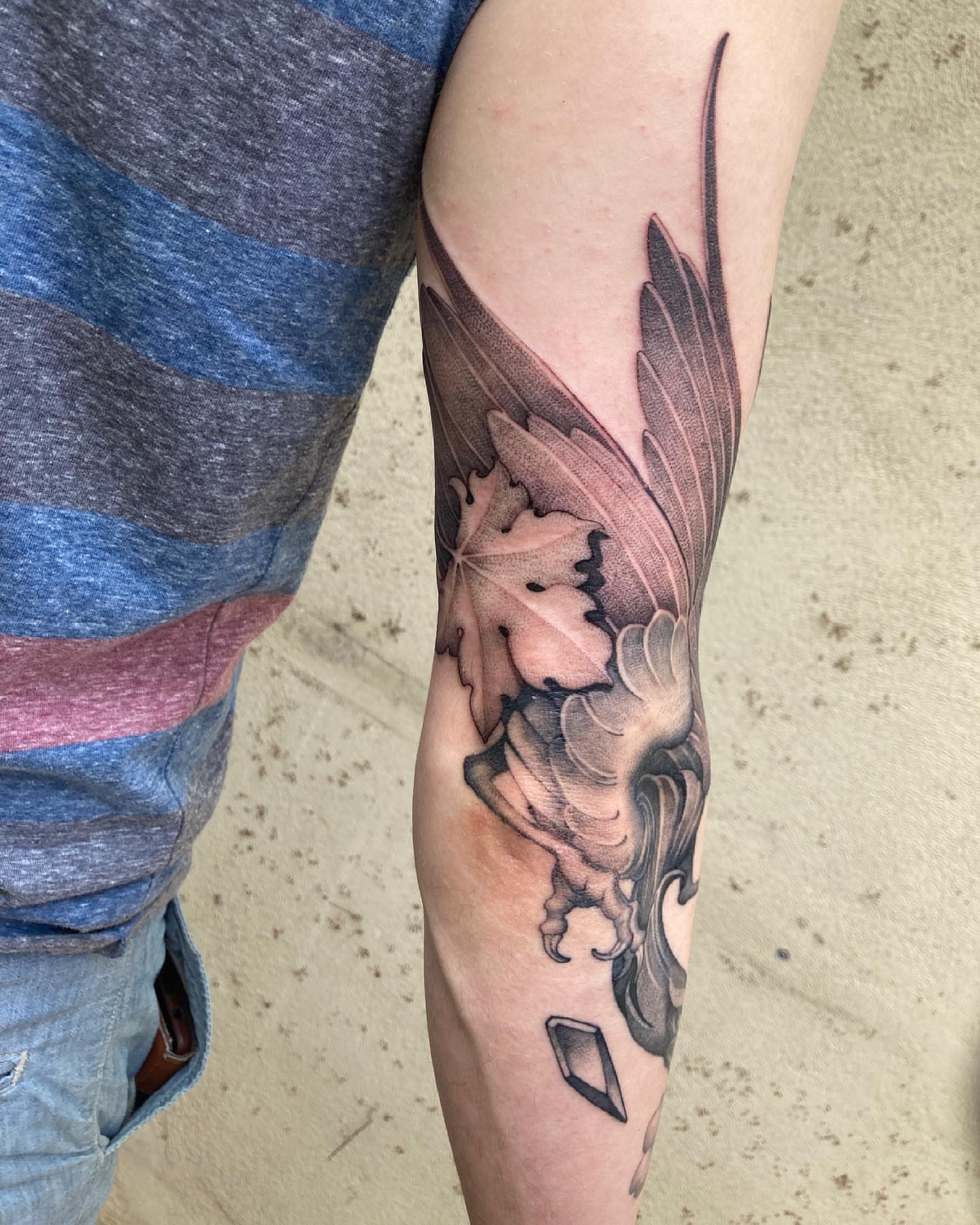 Winged flower realism tattoo on the forearm by Tattoo artist in Charlotte,NC