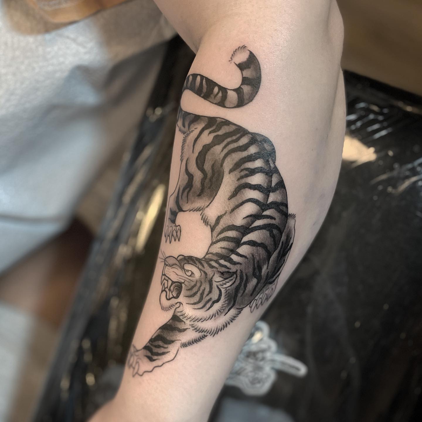 Roaring tiger black and grey tattoo on the forearm by ⠀⠀ ⠀ ⠀ ⠀⠀ ⠀⠀ ⠀⠀ ⠀ ⠀⠀ ⠀⠀ᎪᎳᏃ, West Hollywood, California