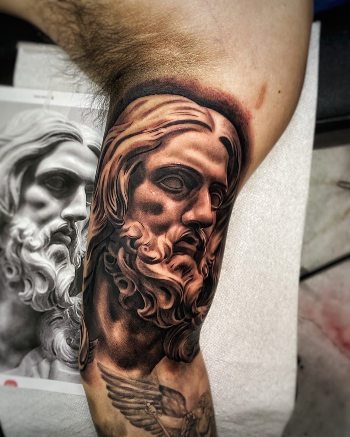 God-like figure realism tattoo on the forearm by Ivan Guadalupe guzman