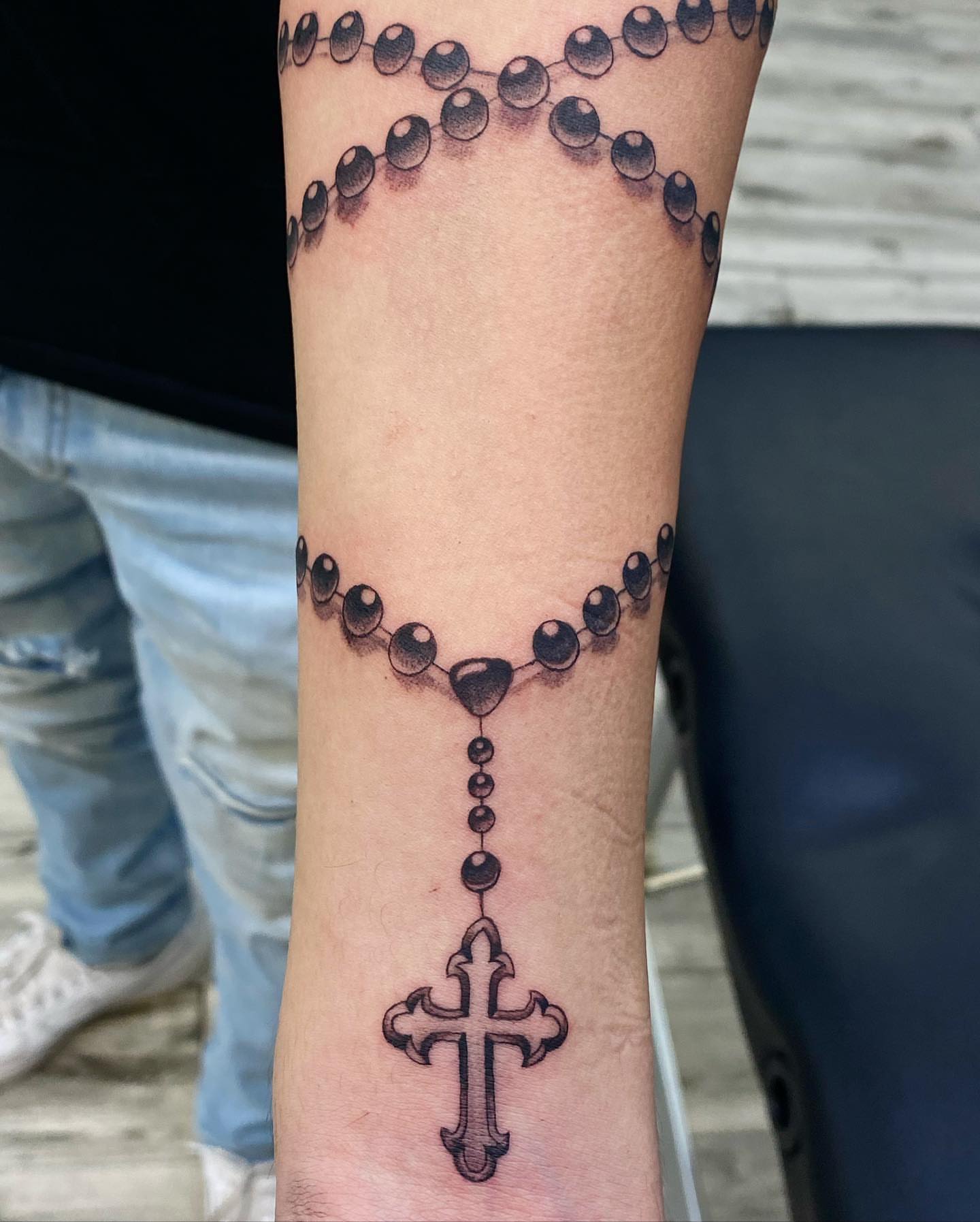 Rosary black and grey tattoo on the forearm by Monique Ortiz, Mesa, Arizona