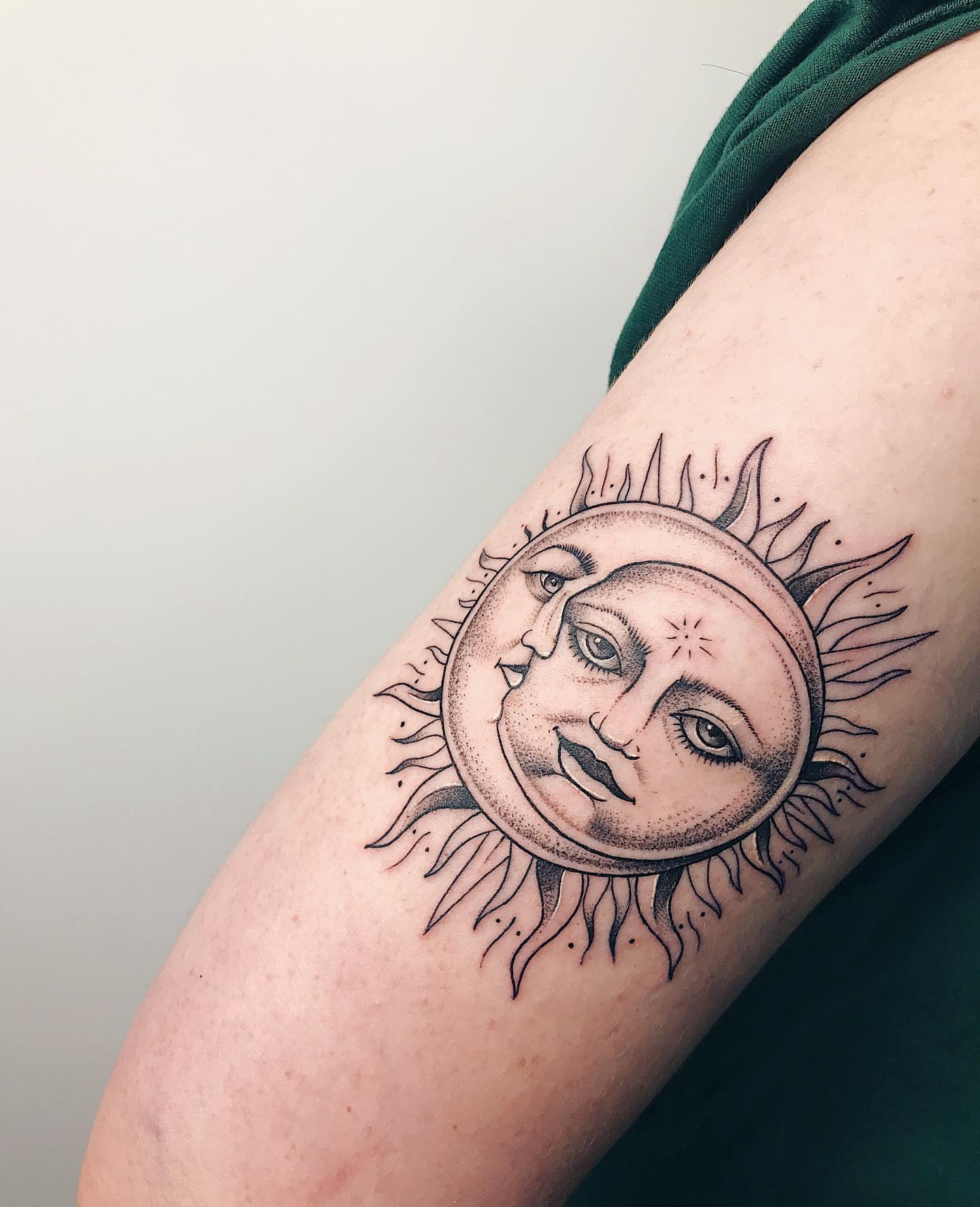Sun and moon dotwork tattoo on the forearm by Annie Overchuk