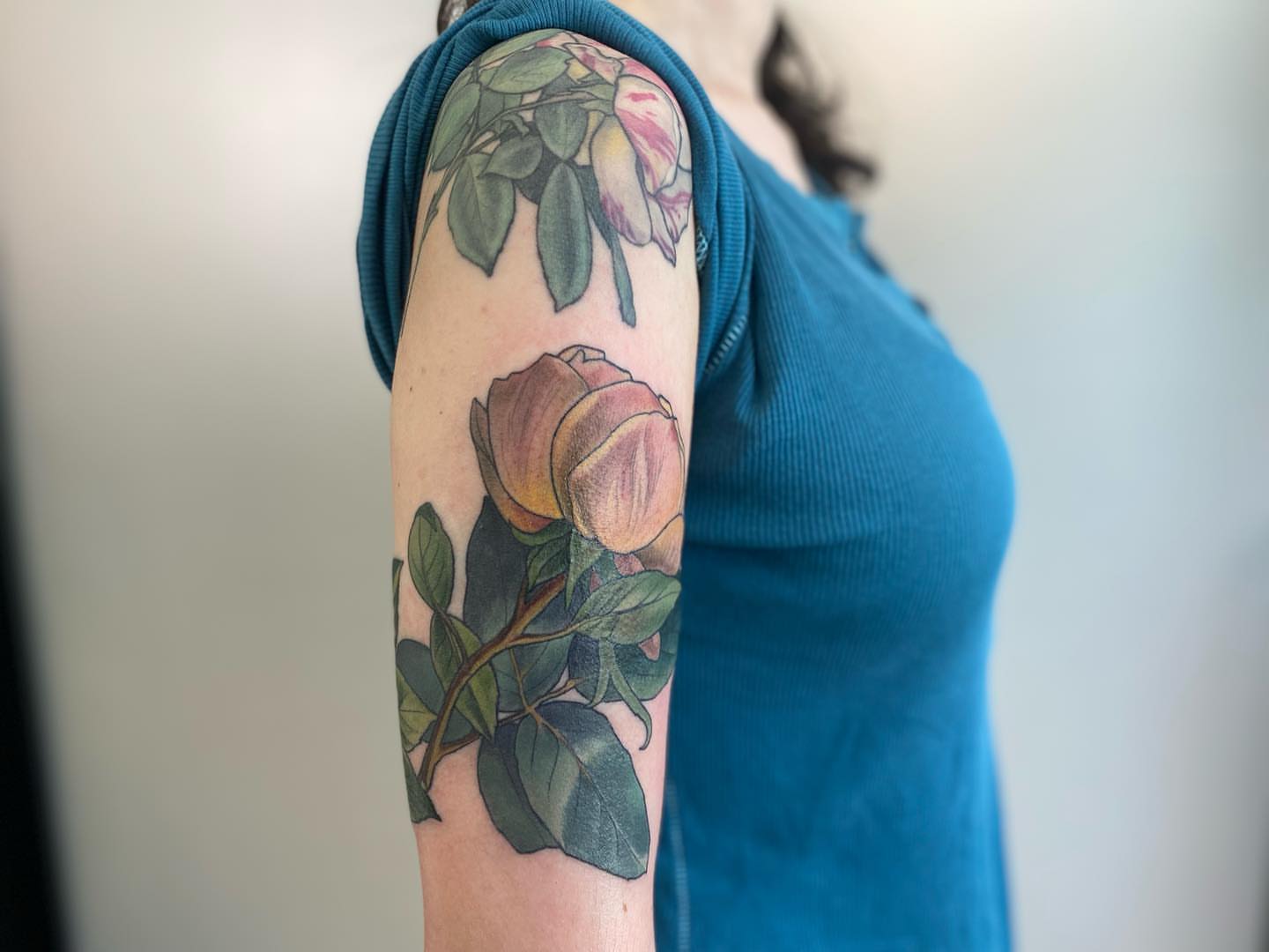 Rose realism tattoo on the forearm by Rusty Indigo