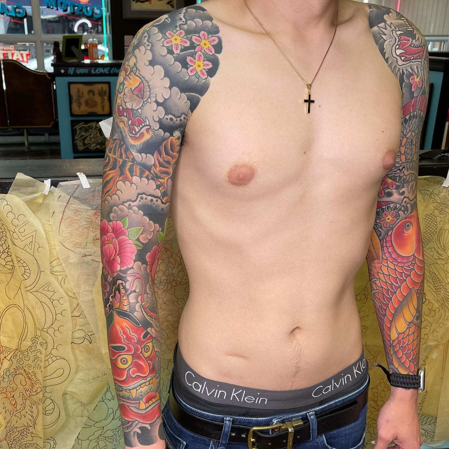 Koi fish and dragon japanese irezumi tattoo on the upper arm by Mark Thompson, Dallas, Texas