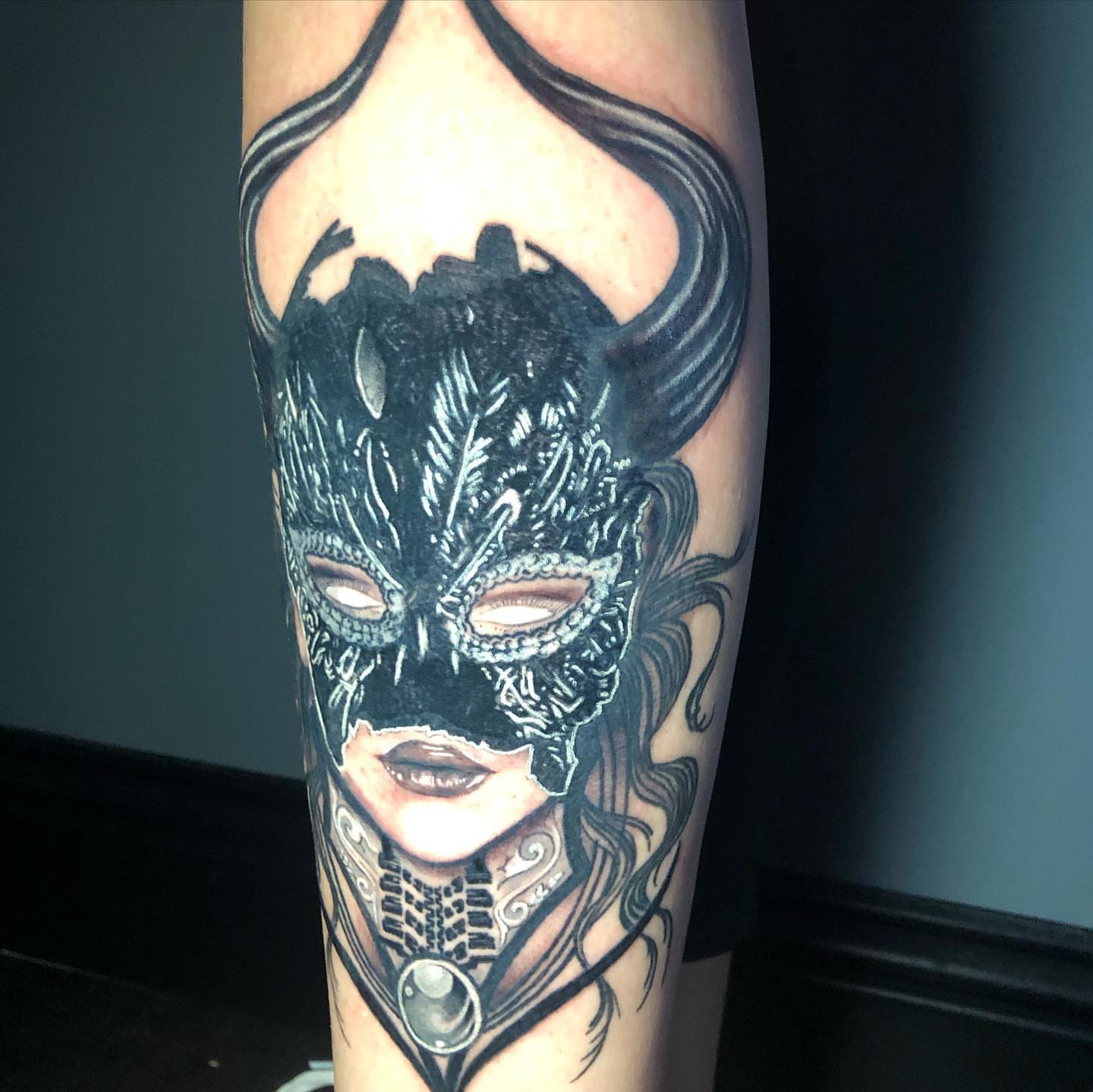 Mask dark realism tattoo on the forearm by Kayden DiGiovanni, Addison, Texas
