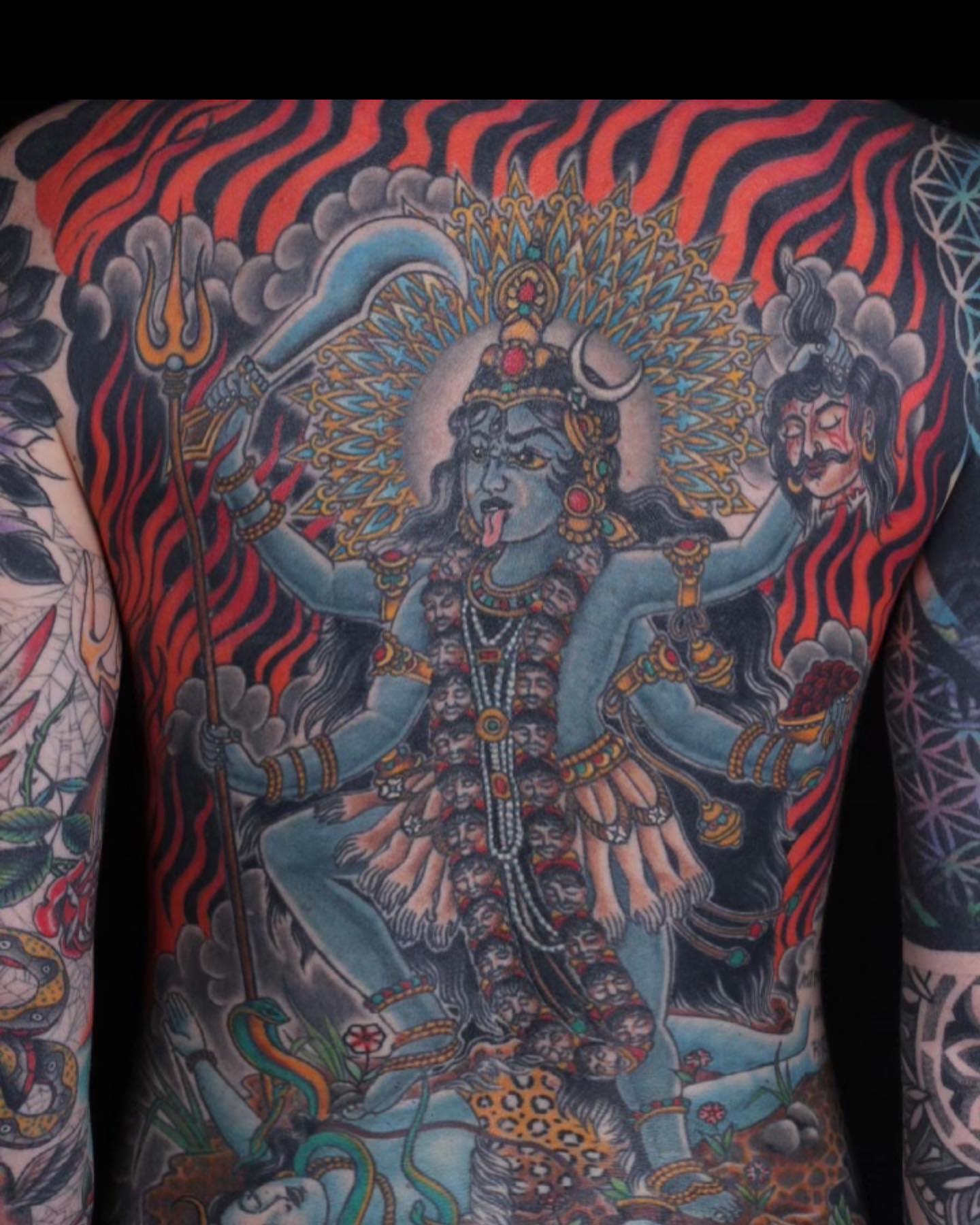 Deity with trident American traditional tattoo on the chest by Haley McMahon