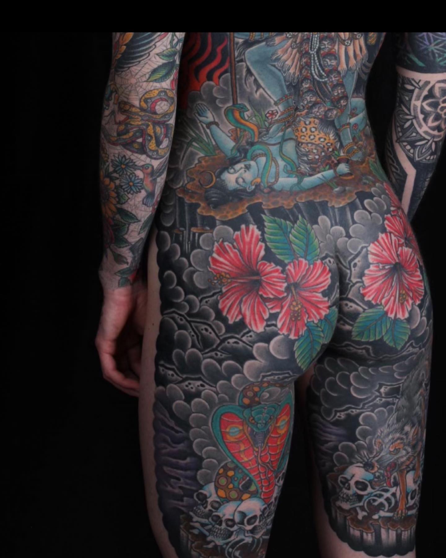 Hawaiian flowers and deity japanese irezumi tattoo on the thigh by Haley McMahon