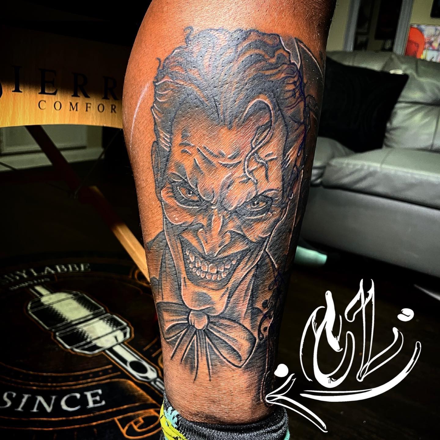 Joker realism tattoo on the forearm by Labbé