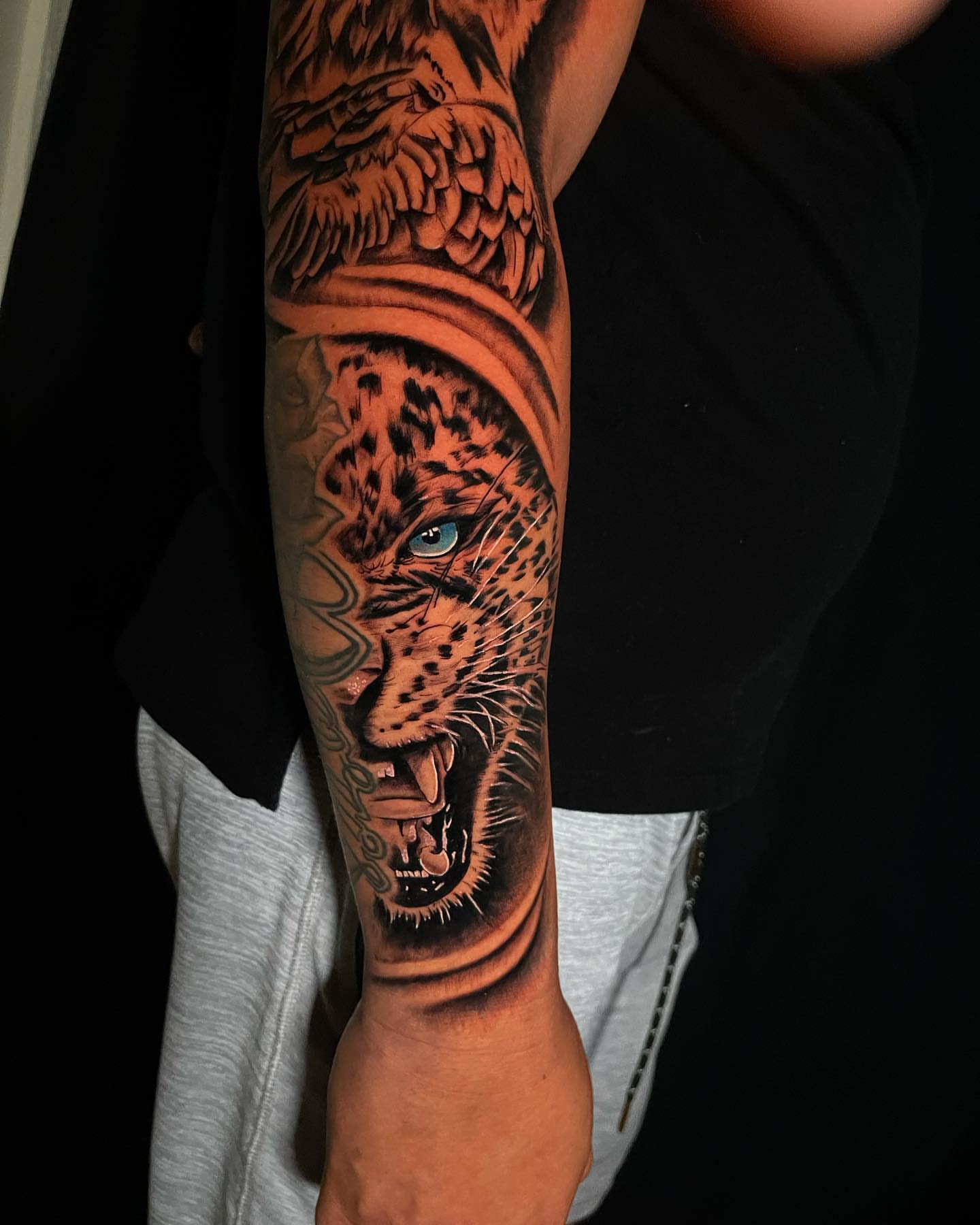 Leopard realism tattoo on the forearm by Dori
