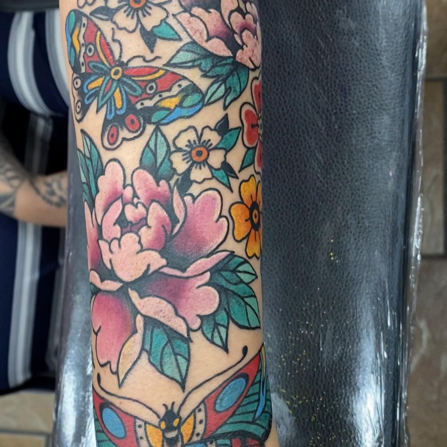 Butterflies and flowers American traditional tattoo on the forearm by Payton Prentice