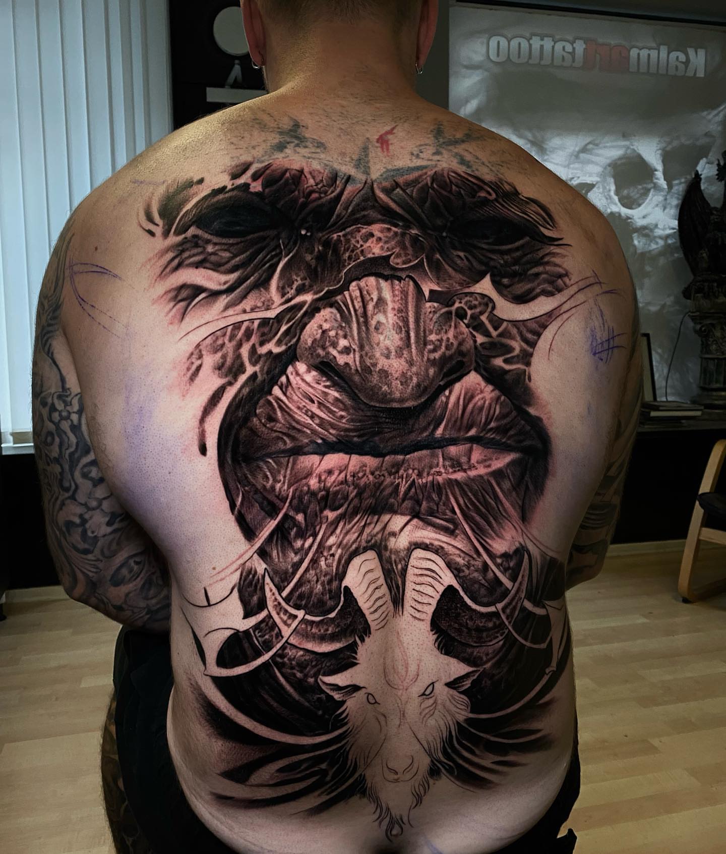 Monster dark realism tattoo on the back by Victor Portugal Tattoo