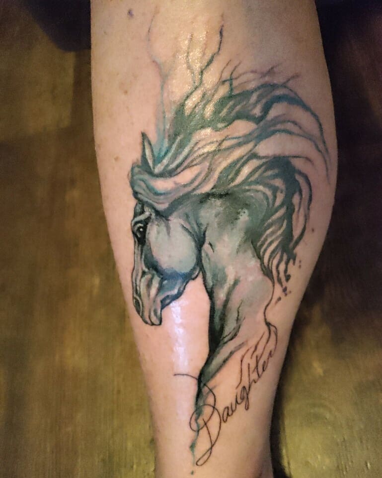 Horse watercolor tattoo on the forearm by Emily Jestine Francis
