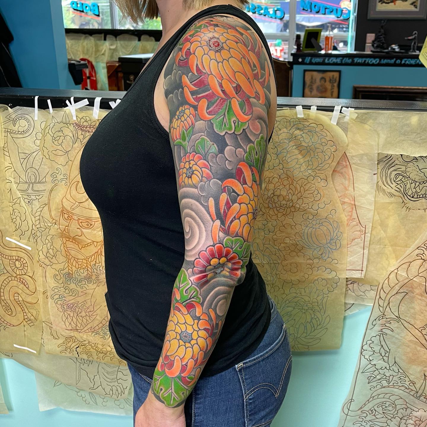 Chrysanthemum japanese irezumi tattoo on the upper arm by Mark Thompson, Dallas, Texas
