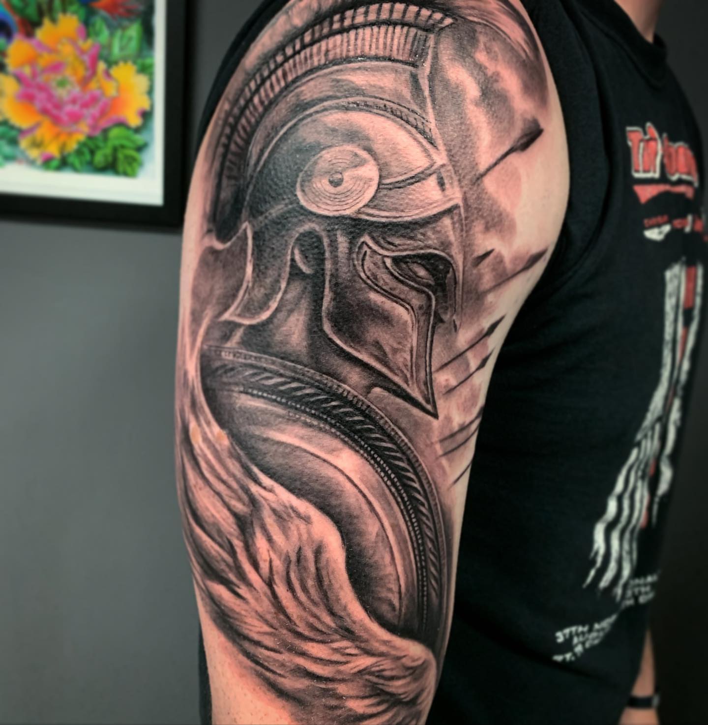 Helmeted warrior realism tattoo on the upper arm by TyEsha Reels