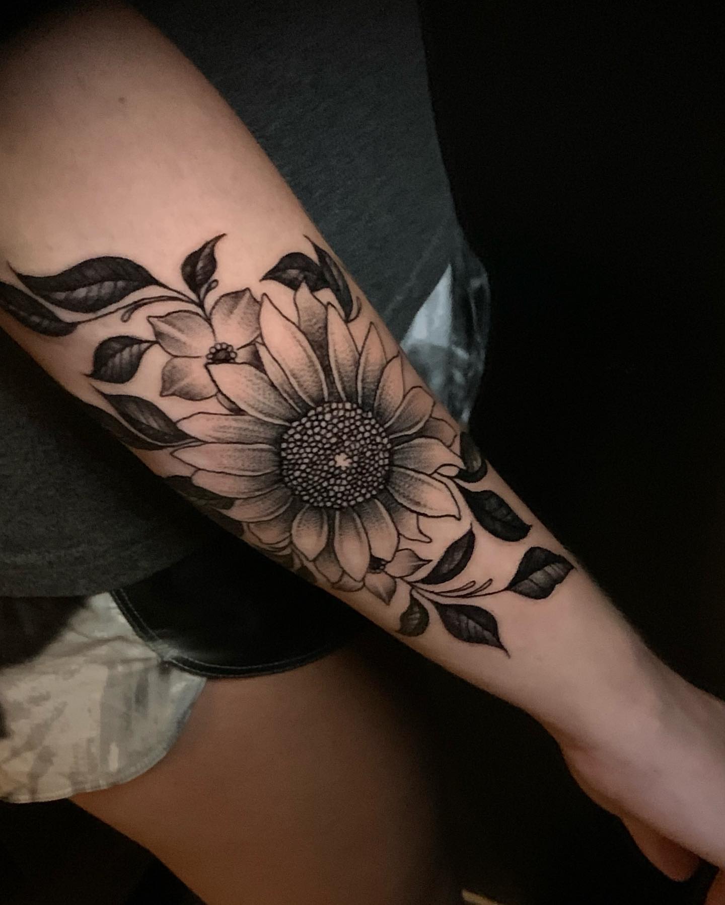 Sunflower black and grey tattoo on the forearm by Seth Scott