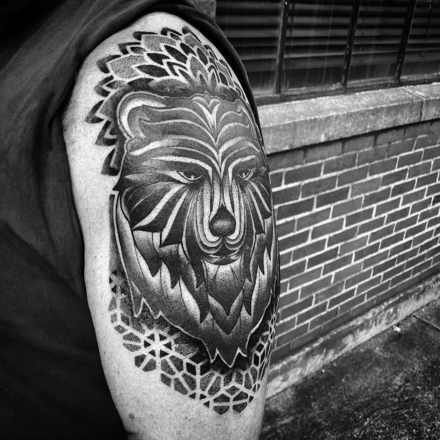Lion geometric tattoo on the shoulder by Ałex, Portland, Oregon