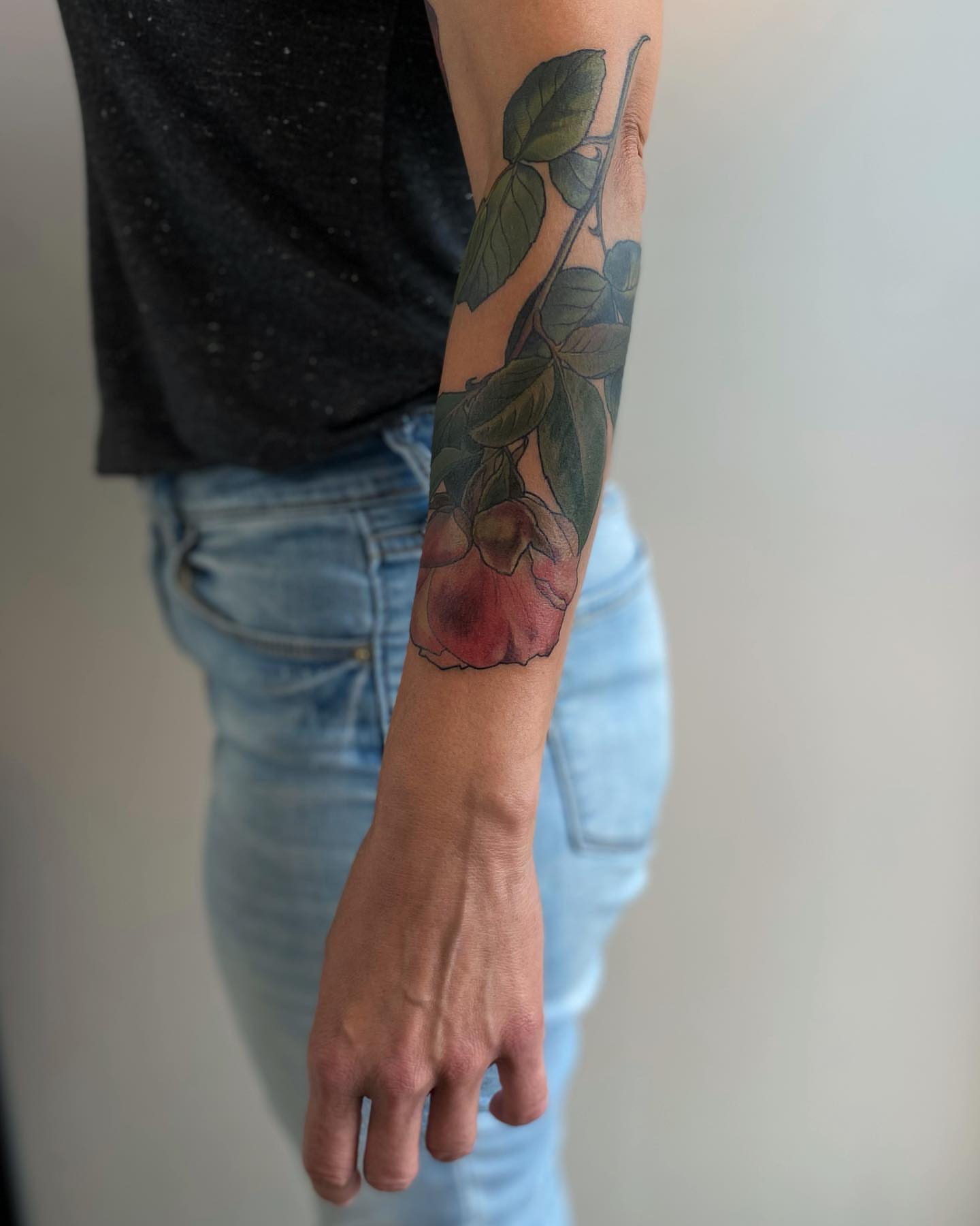 Fruit branch realism tattoo on the forearm by Rusty Indigo
