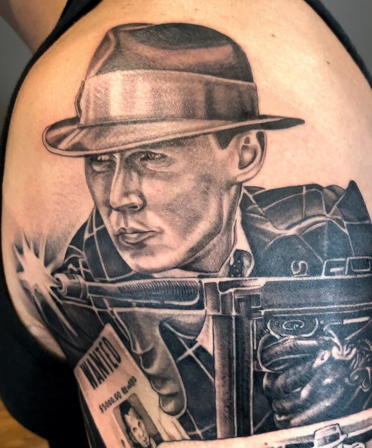 Indiana jones realism tattoo on the shoulder by Elijah Forster - Nashville Tattoo Artist