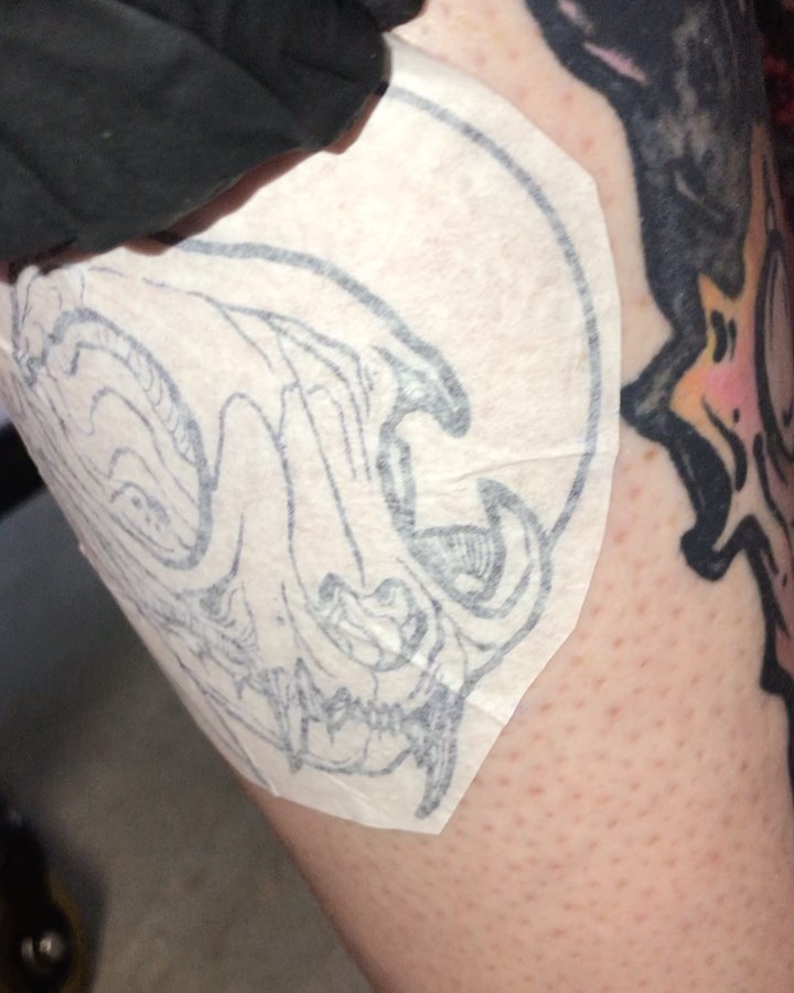 Skull black and grey tattoo on the thigh by Riley Oats