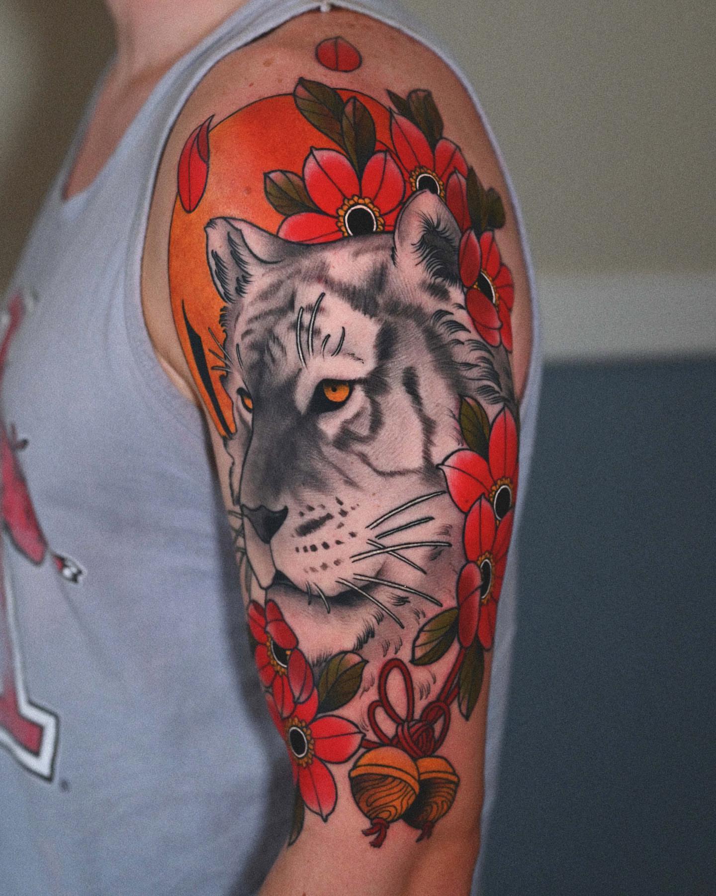 White tiger with flowers realism tattoo on the forearm by Lorenzo Lopez