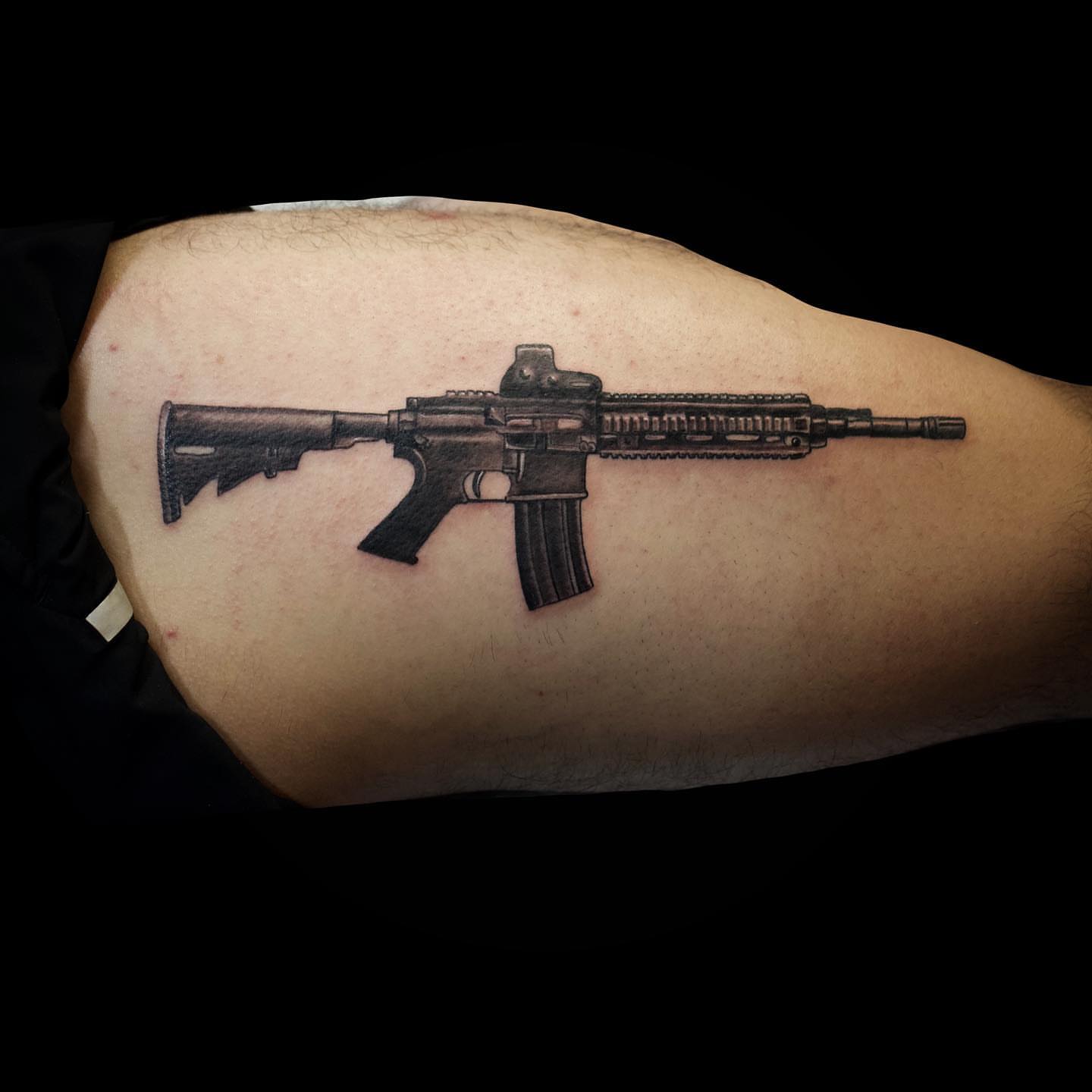 Assault rifle black and grey tattoo on the thigh by all gas no brakes! no days off!