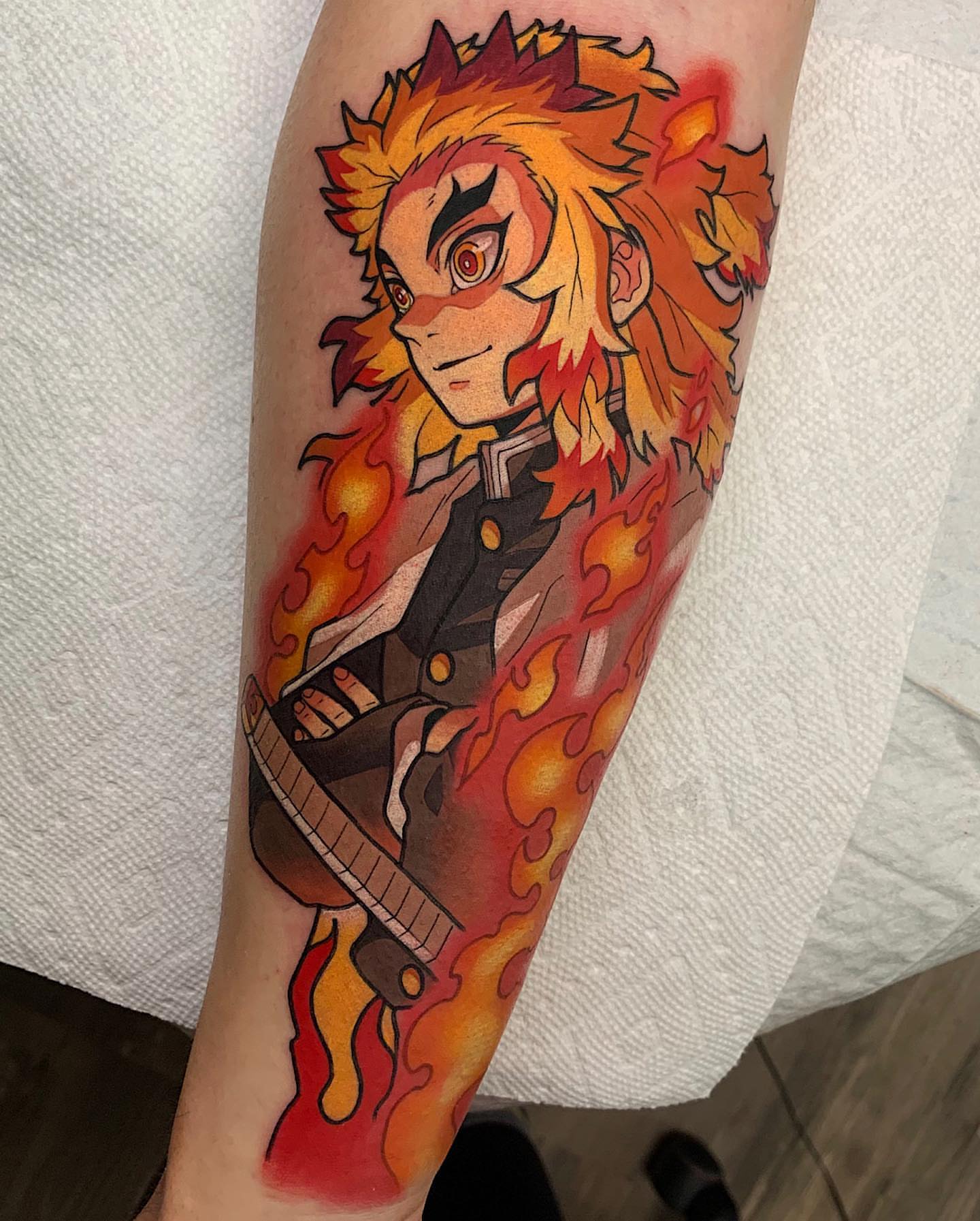Flame demon anime tattoo on the forearm by Shelby Ouellette