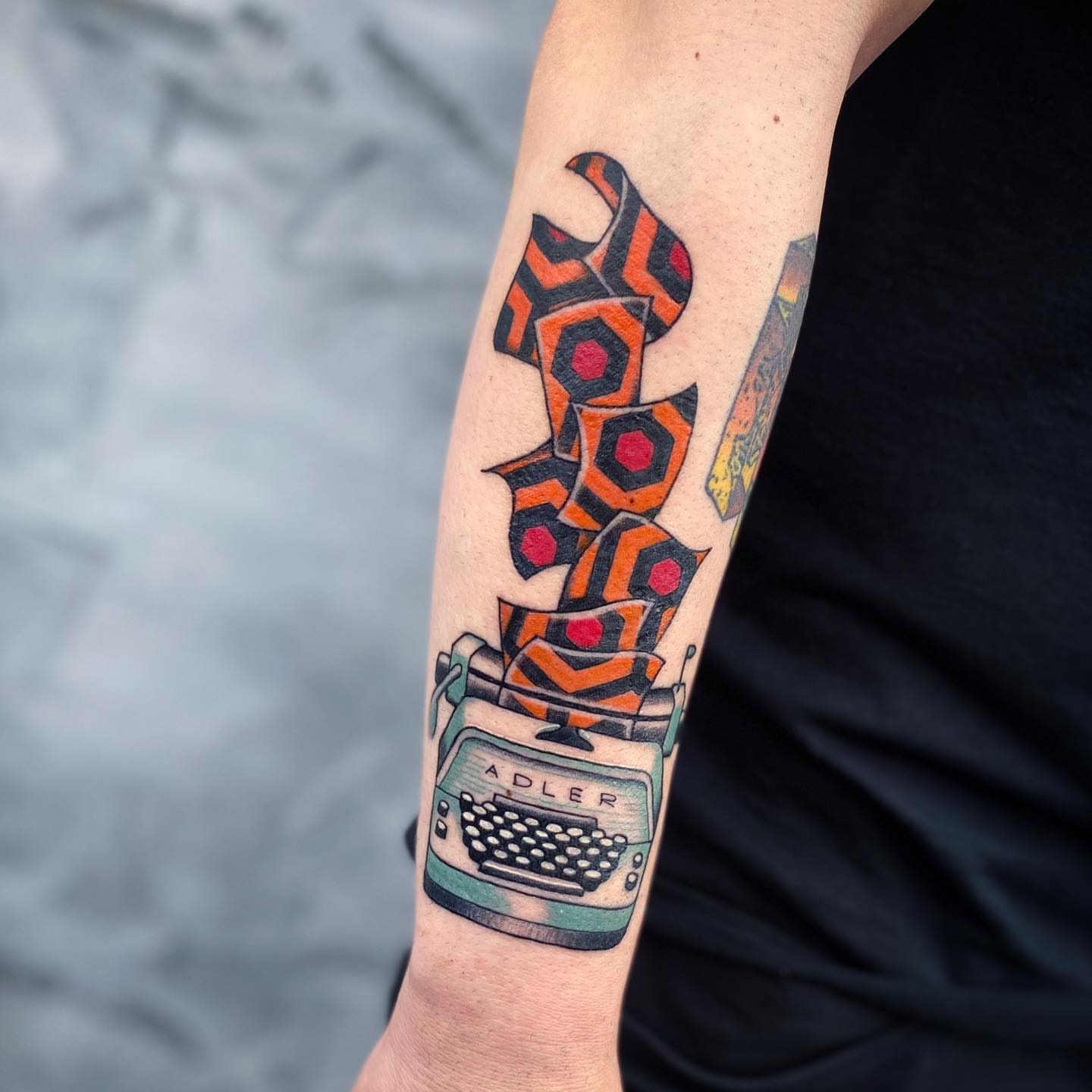 Typewriter and geometric shapes American traditional tattoo on the forearm by Dave Shurman