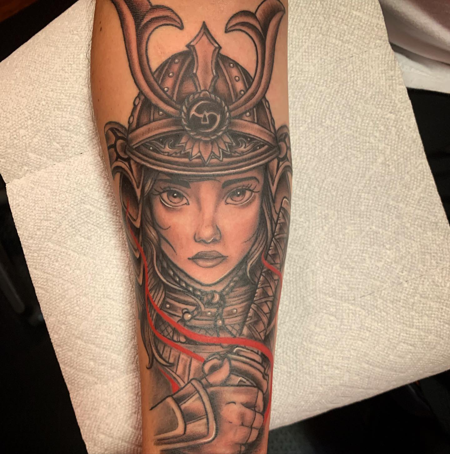 Female warrior realism tattoo on the forearm by Brad Sterling