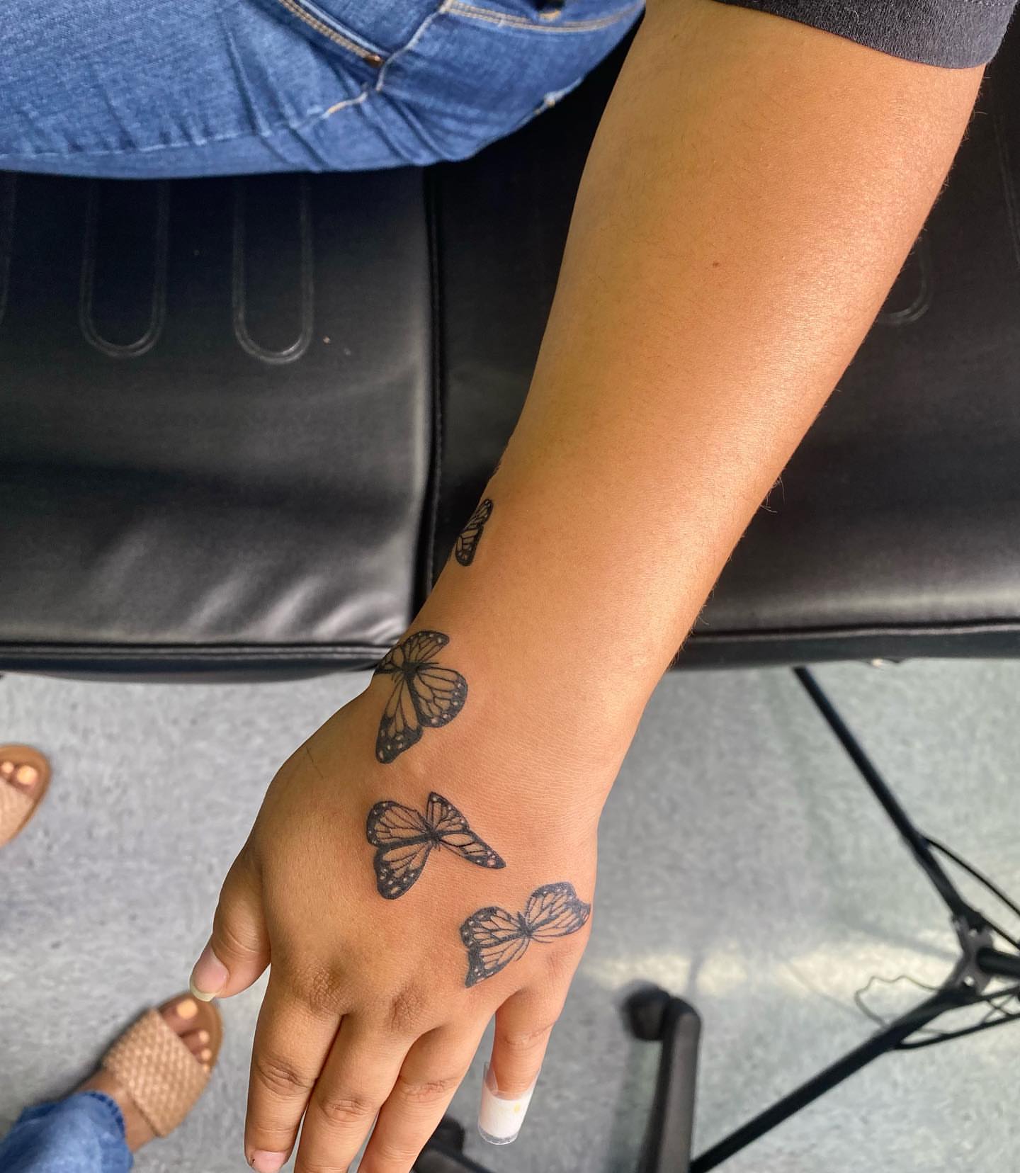 Butterflies black and grey tattoo on the hand by Steph π€