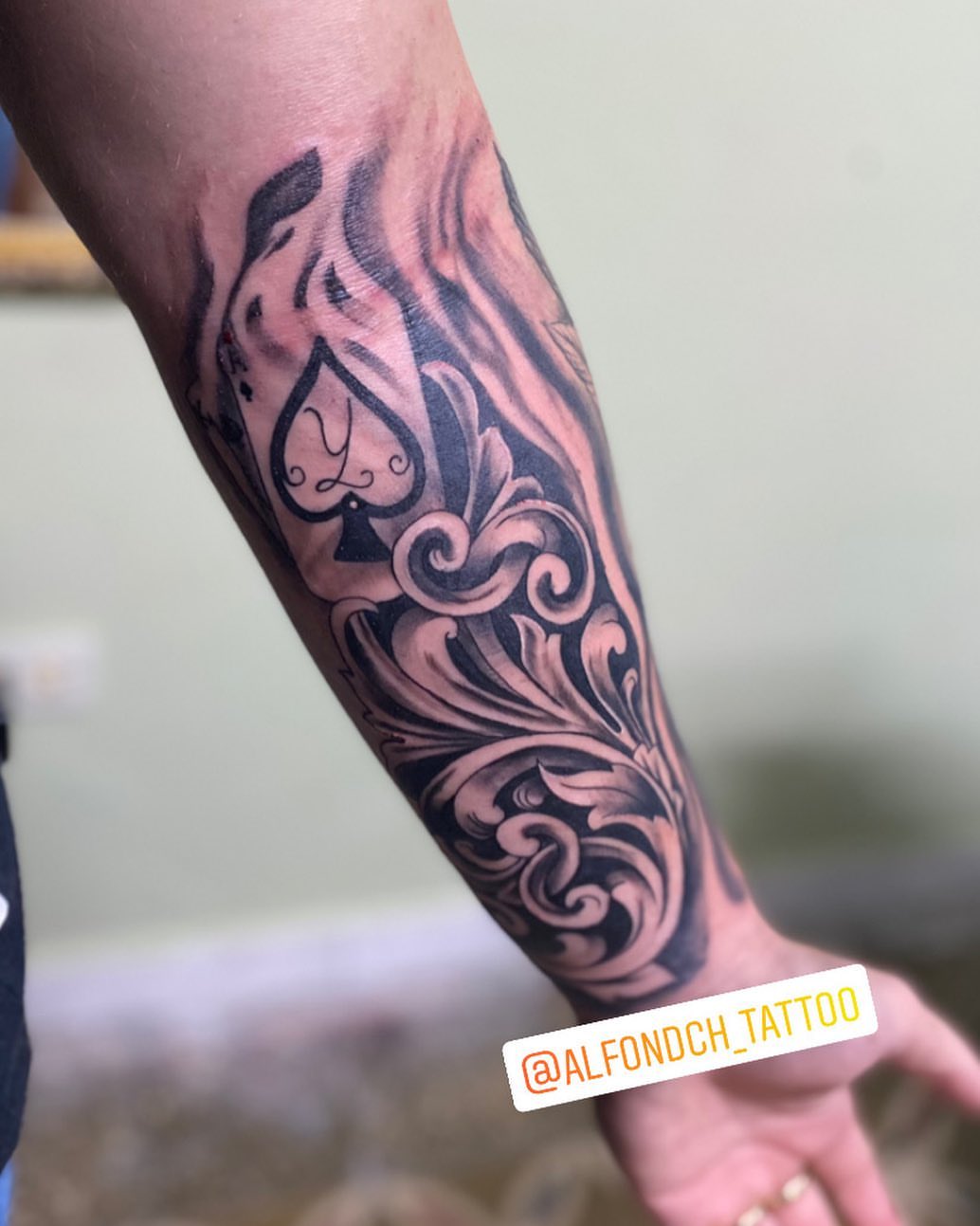 Floral design black and grey tattoo on the forearm by Alfonso Duenas