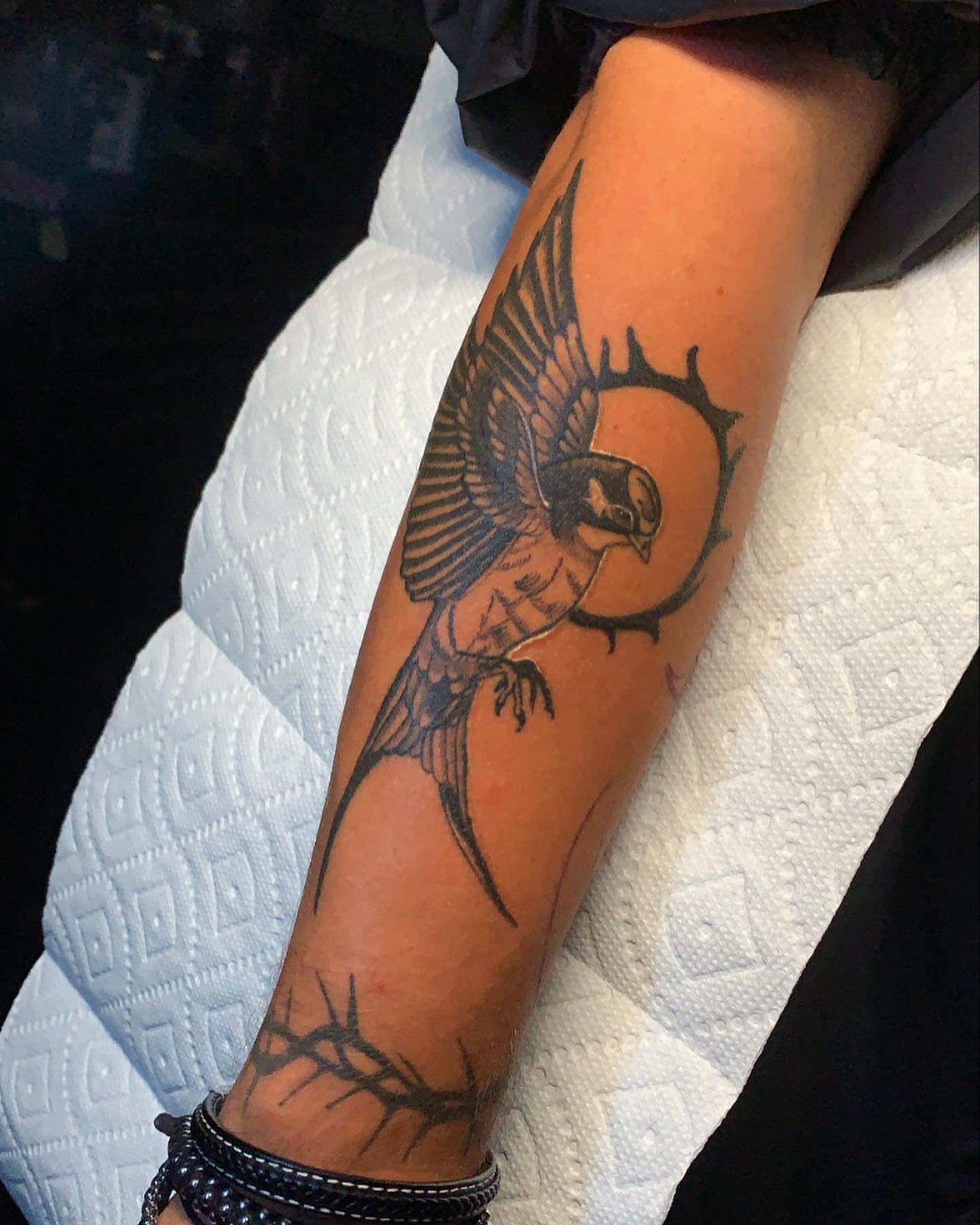 Swallow black and grey tattoo on the forearm by Edward A. Boesch