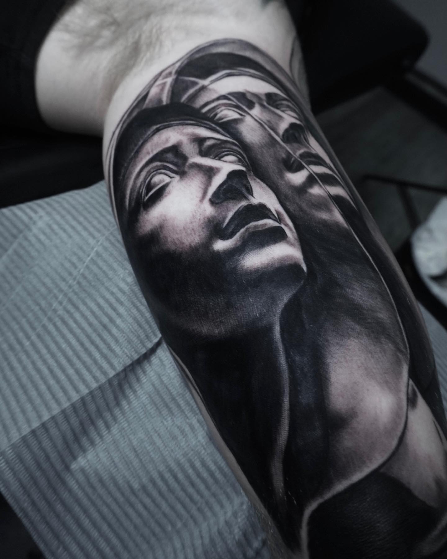 Portrait realism tattoo on the forearm by Brian Cassidy